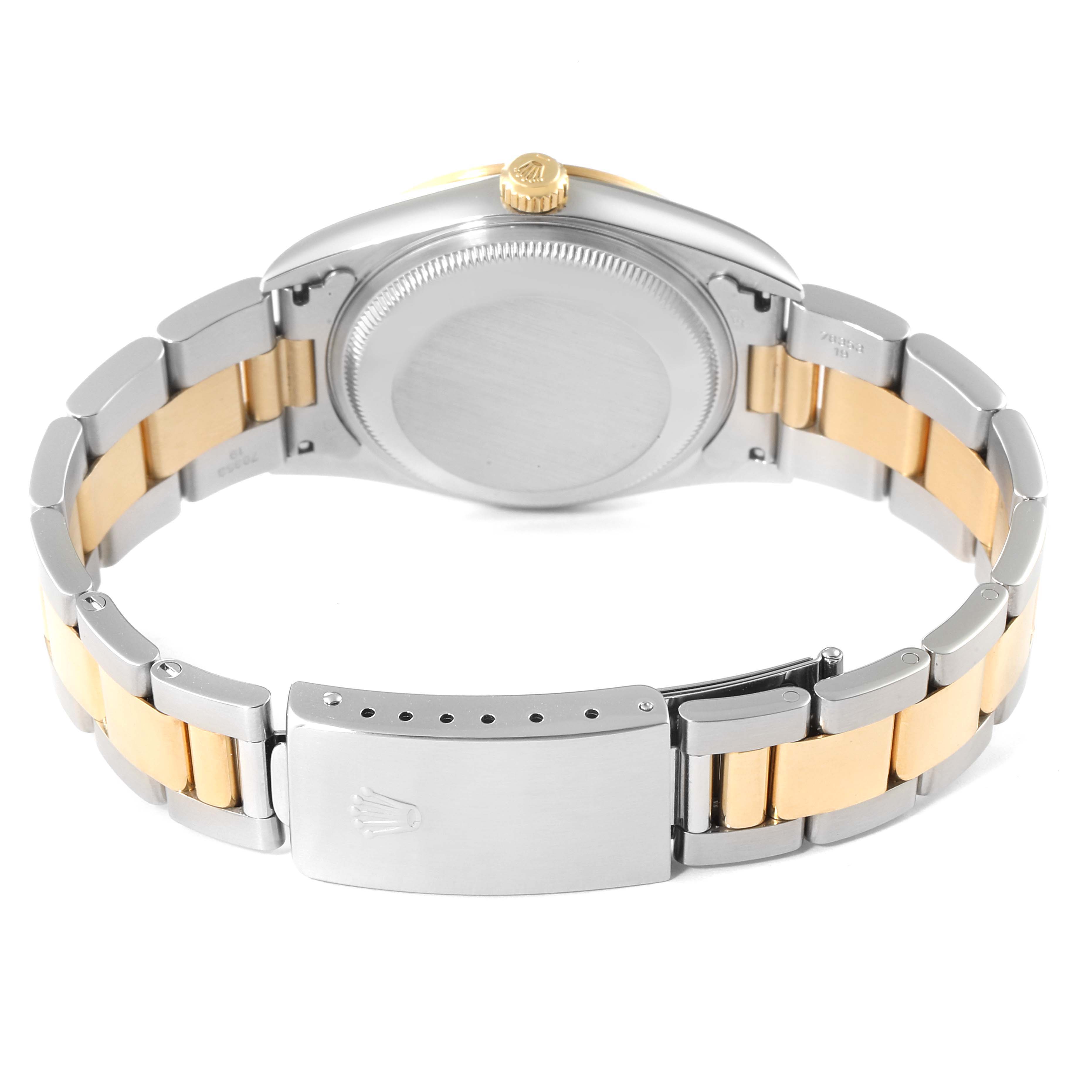 The image shows the back view of a Rolex Date 15203 Men's Steel and Gold (two tone) Black Dial 15203 Men's Steel and Gold (two tone) Black Dial model watch, highlighting its case back, crown, and two-tone metal bracelet.