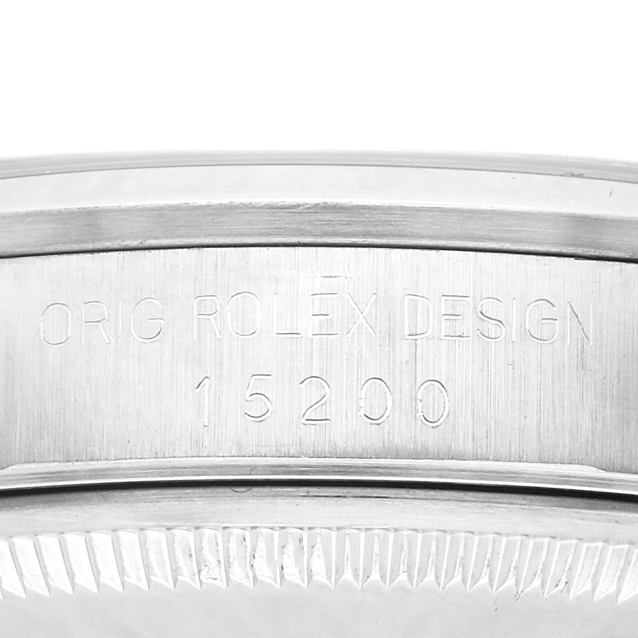 The image shows the side view of the Rolex Date model 15200 watch, focusing on the engravings on the case.
