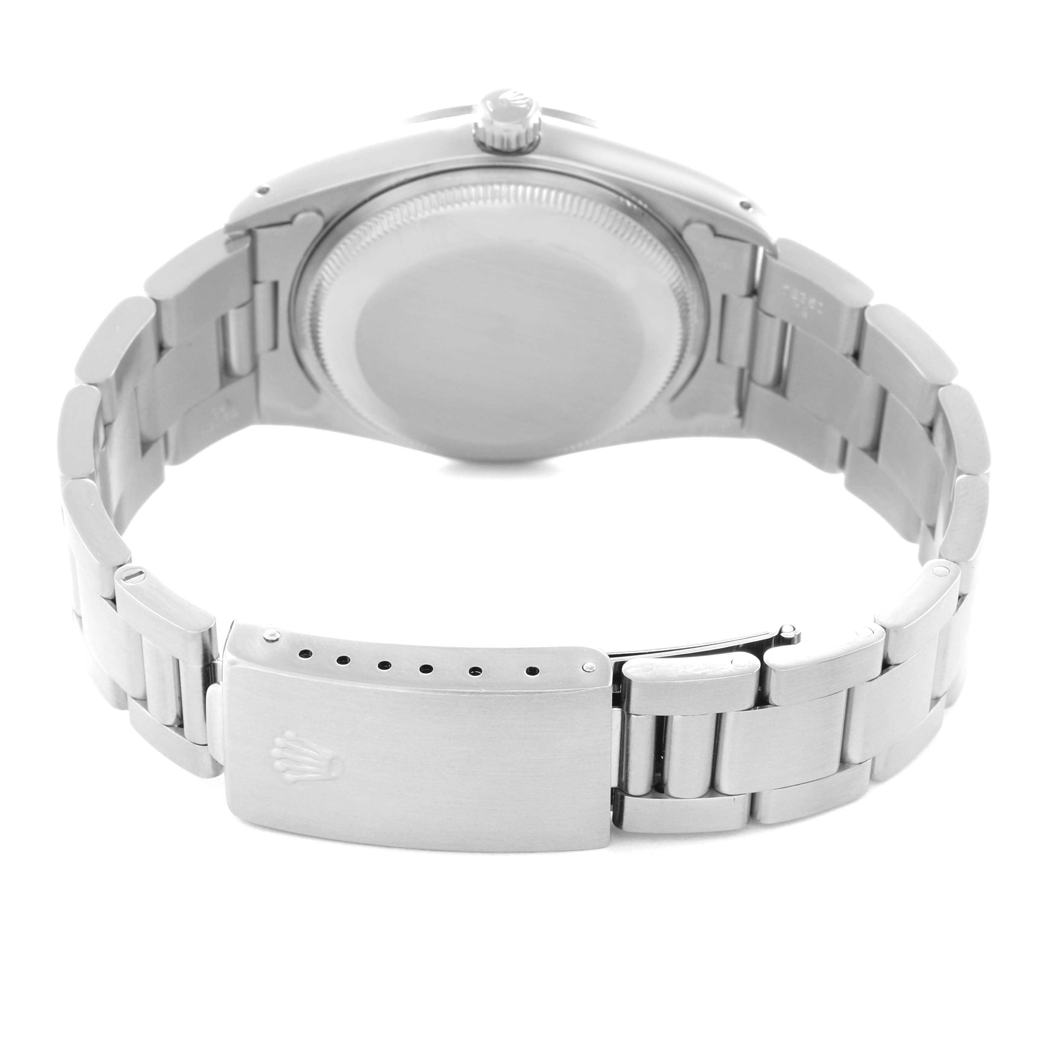 The image shows the back of a Rolex Date model 15200 men's watch, displaying the case back and metal bracelet with the clasp.