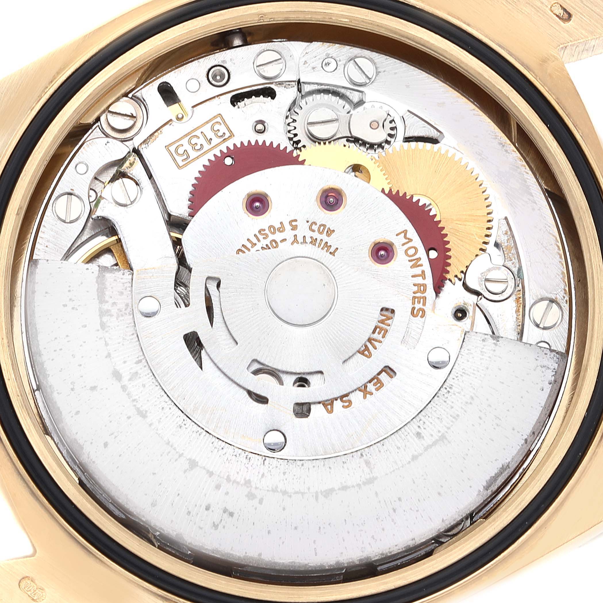 This image shows the internal mechanical movement of a Rolex Datejust 16238 Men's Yellow Gold Champagne Dial 16238 Men's Yellow Gold Champagne Dial watch, highlighting gears and components from a close-up angle.
