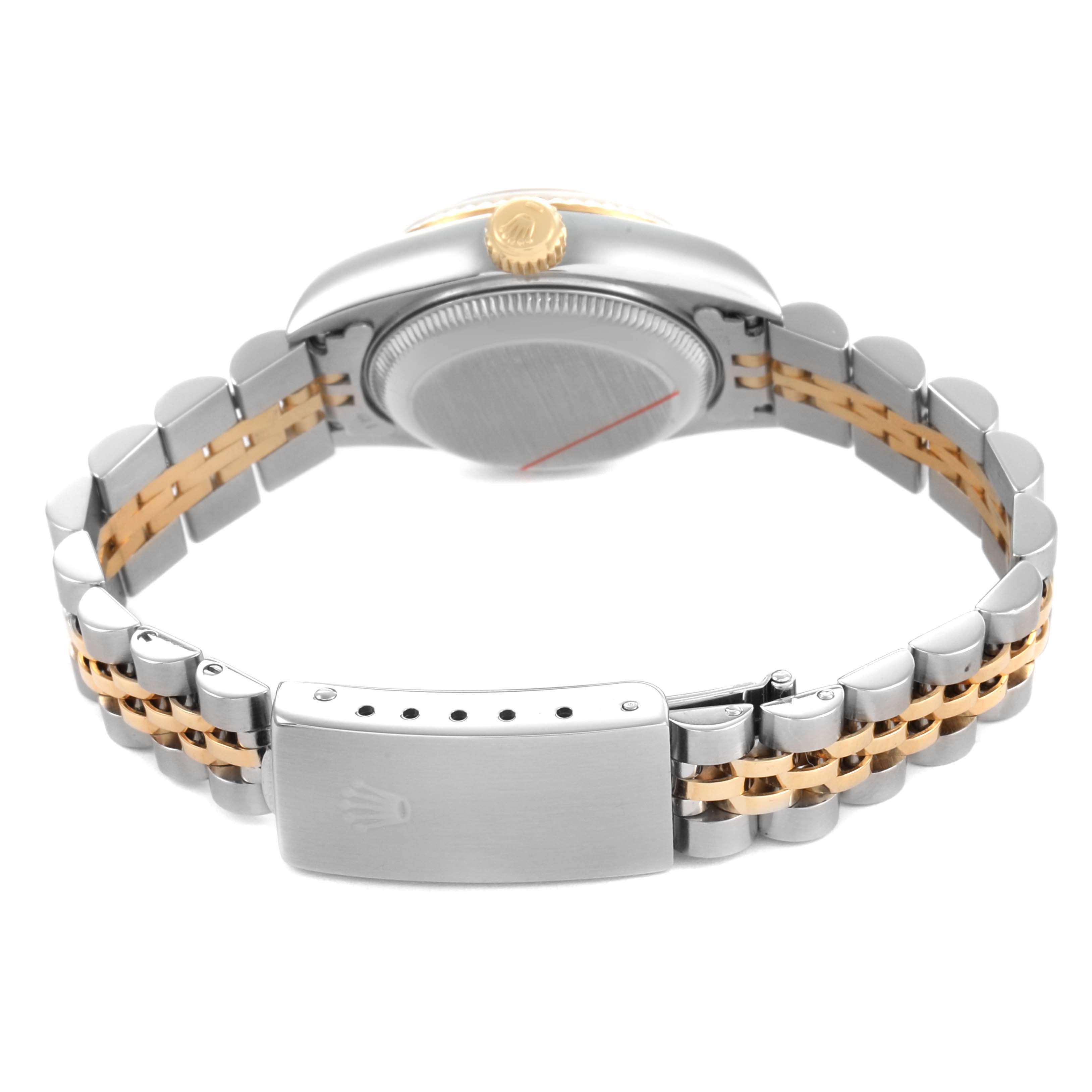 The image shows the back view of a Rolex Datejust 69173 Women's Stainless Steel Champagne Dial, highlighting the case back, gold crown, and two-tone bracelet with clasp.