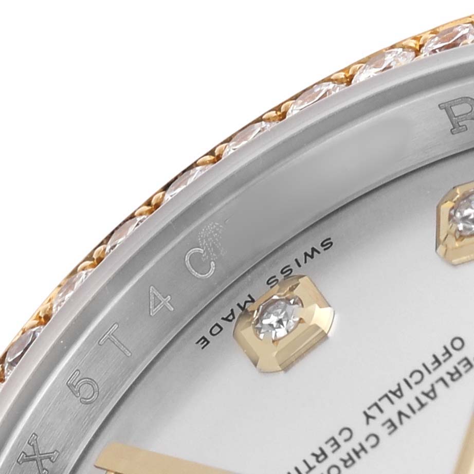 The image shows a close-up of a Rolex Datejust 116243 Men's Stainless Steel Silver Dial watch, highlighting the bezel with diamonds and part of the dial and hour markers.