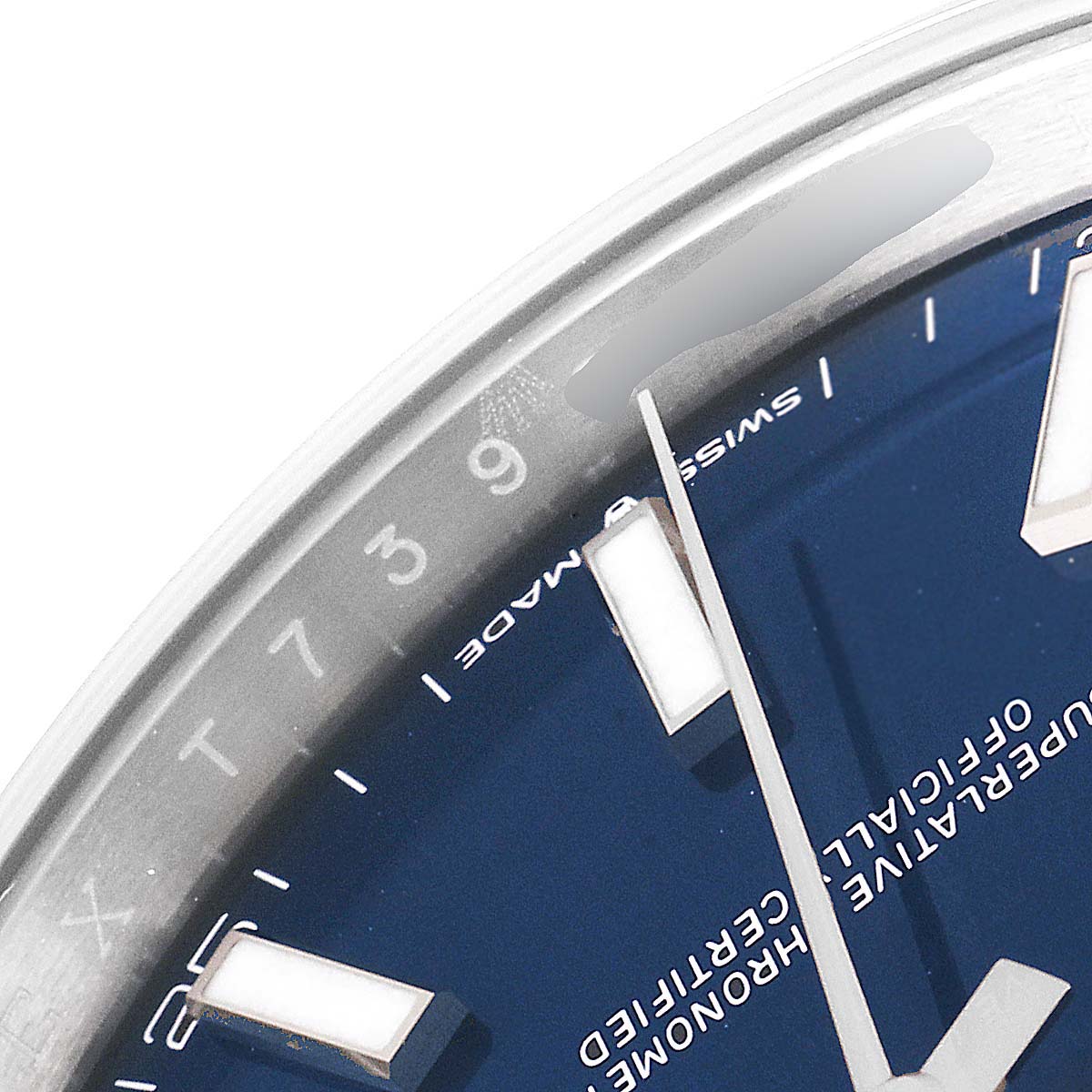 This close-up image shows the blue dial and part of the bezel with hour markers of the Rolex Datejust 41 126300 Men
s Stainless Steel Blue Dial 126300 Men
s Stainless Steel Blue Dial model.