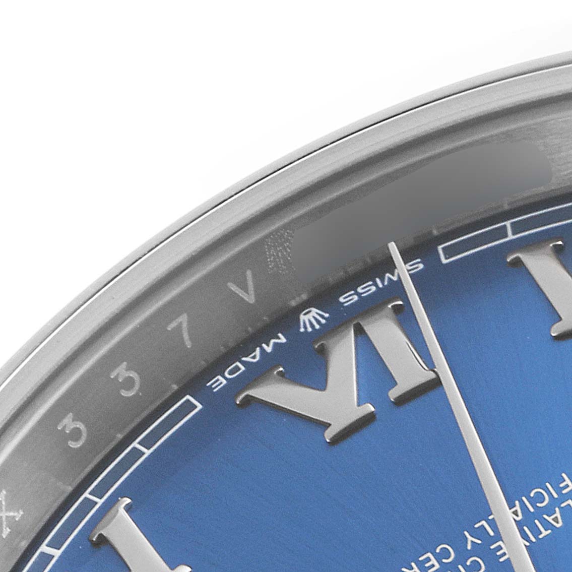 This close-up of the Rolex Datejust 41 126300 Men
s Stainless Steel Blue Dial 126300 Men
s Stainless Steel Blue Dial model showcases the edge of the dial, the Roman numeral hour marker, and part of the bezel.