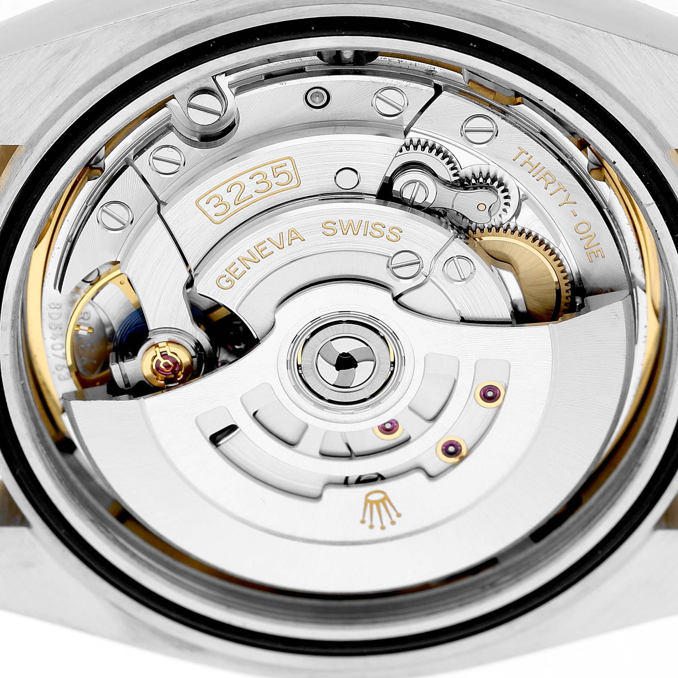 The image shows the movement and rotor of a Rolex Datejust 41 126333 Men's Steel and Gold (two tone) Mother of Pearl Dial, showcasing intricate details from the back.