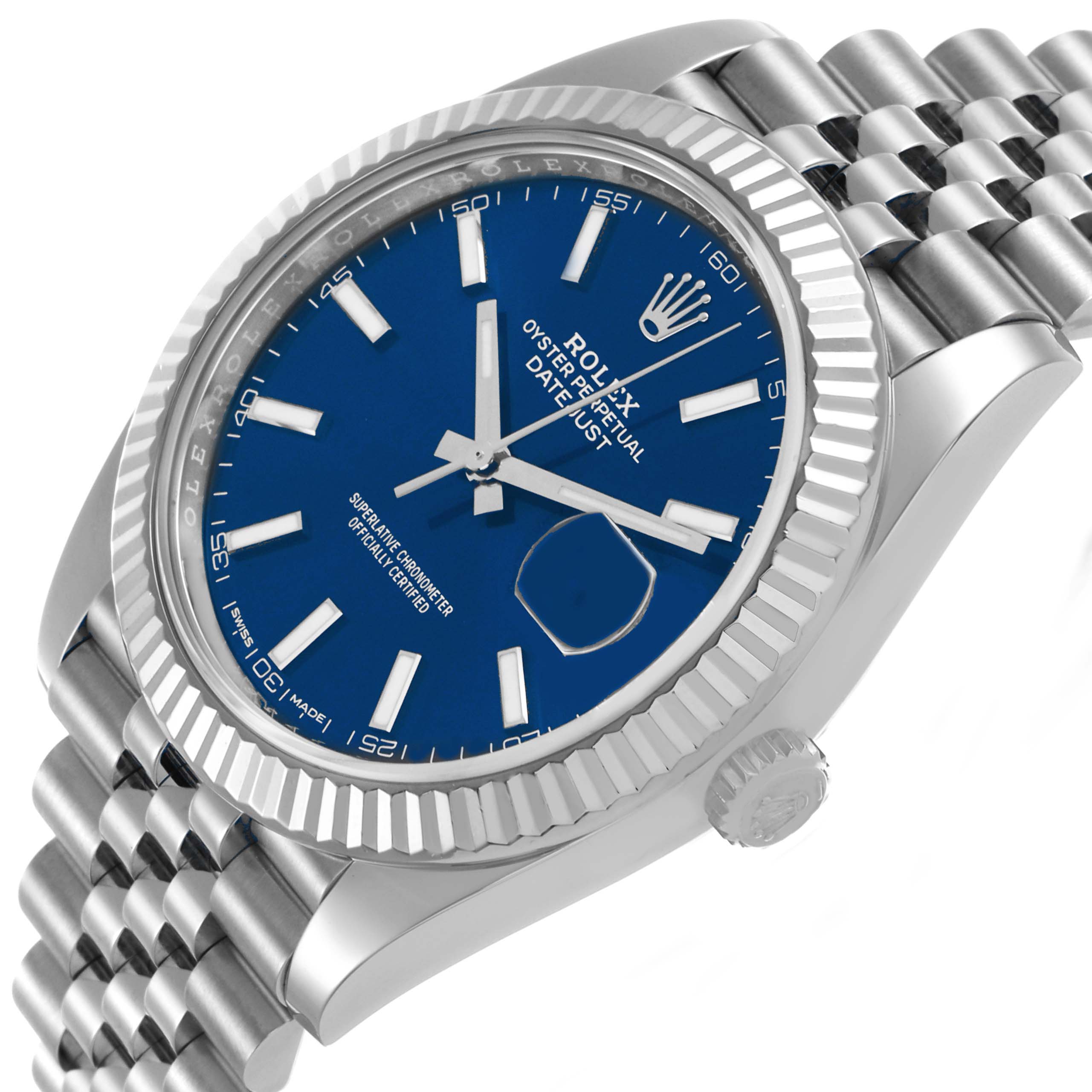 The image shows a Rolex Datejust 41 126334 Men's Stainless Steel Blue Dial at an angled view, highlighting the blue dial, fluted bezel, and Jubilee bracelet.