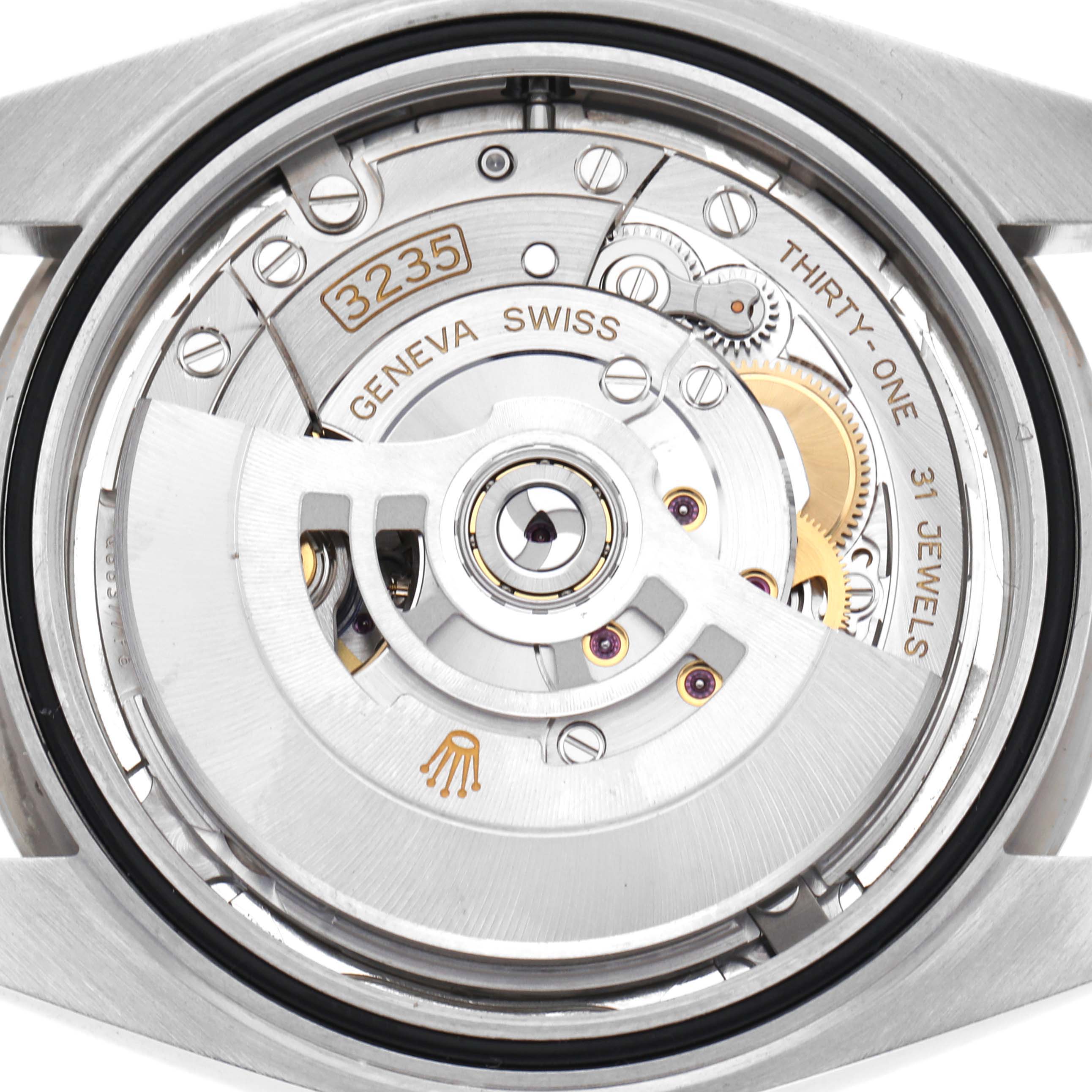 The image shows the movement of a Rolex Datejust 41, model 126334, highlighting the rotor, gears, and jewels from a back angle.