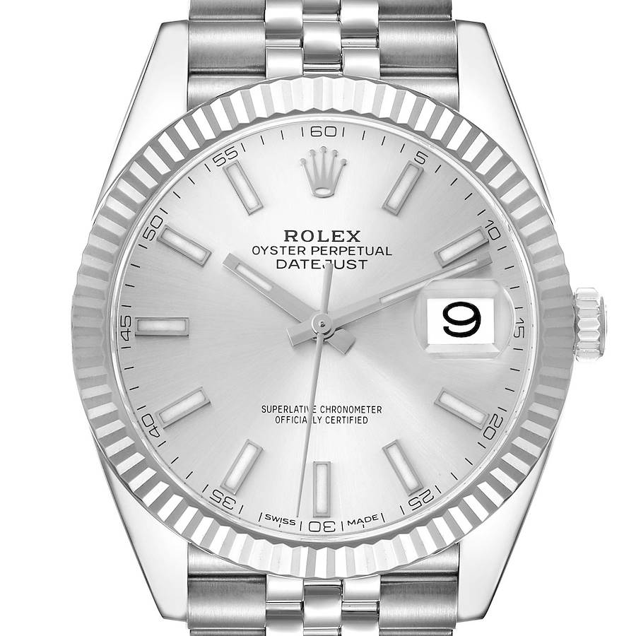 The Rolex Datejust 41 model 126334 is shown from the front, highlighting its fluted bezel, silver dial, and Cyclops lens over the date window.