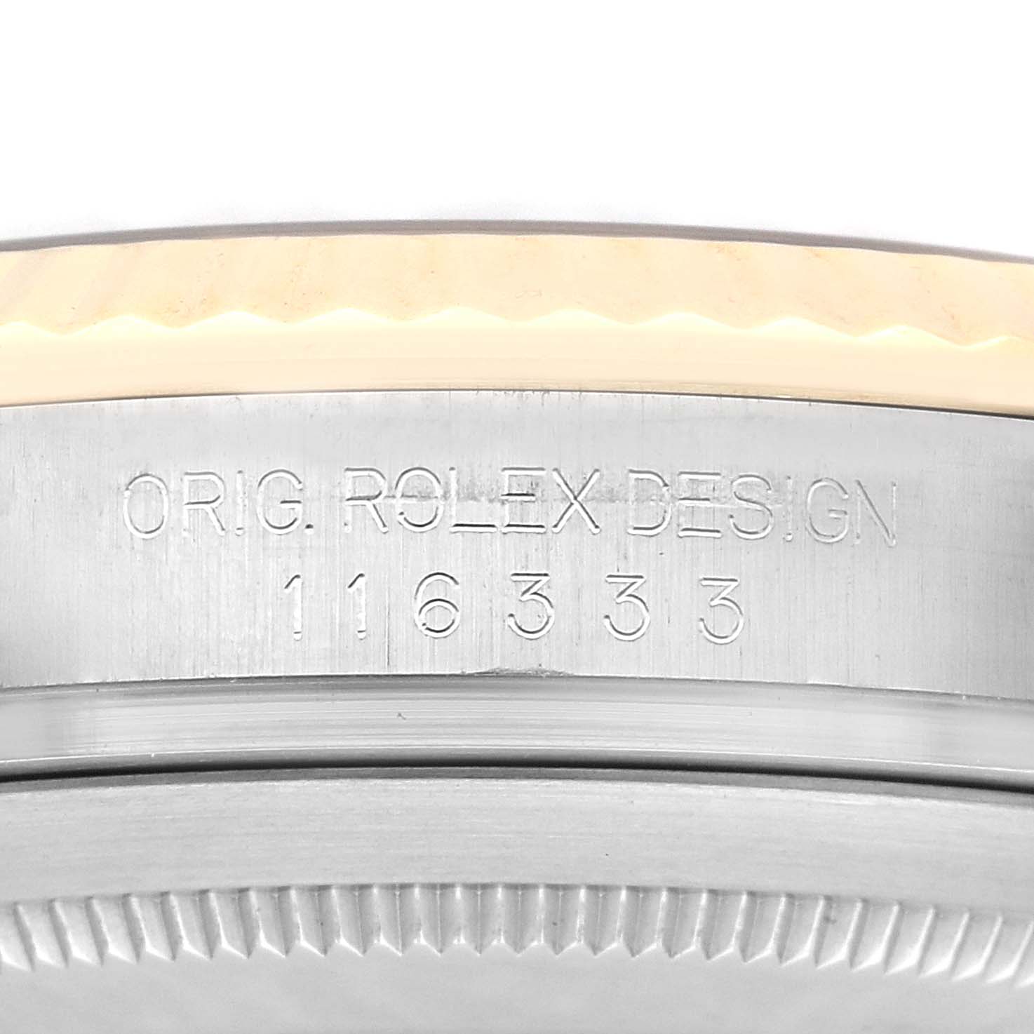 The image focuses on the side of a Rolex Datejust 41 watch, model number 116333, showing engravings on the case edge.