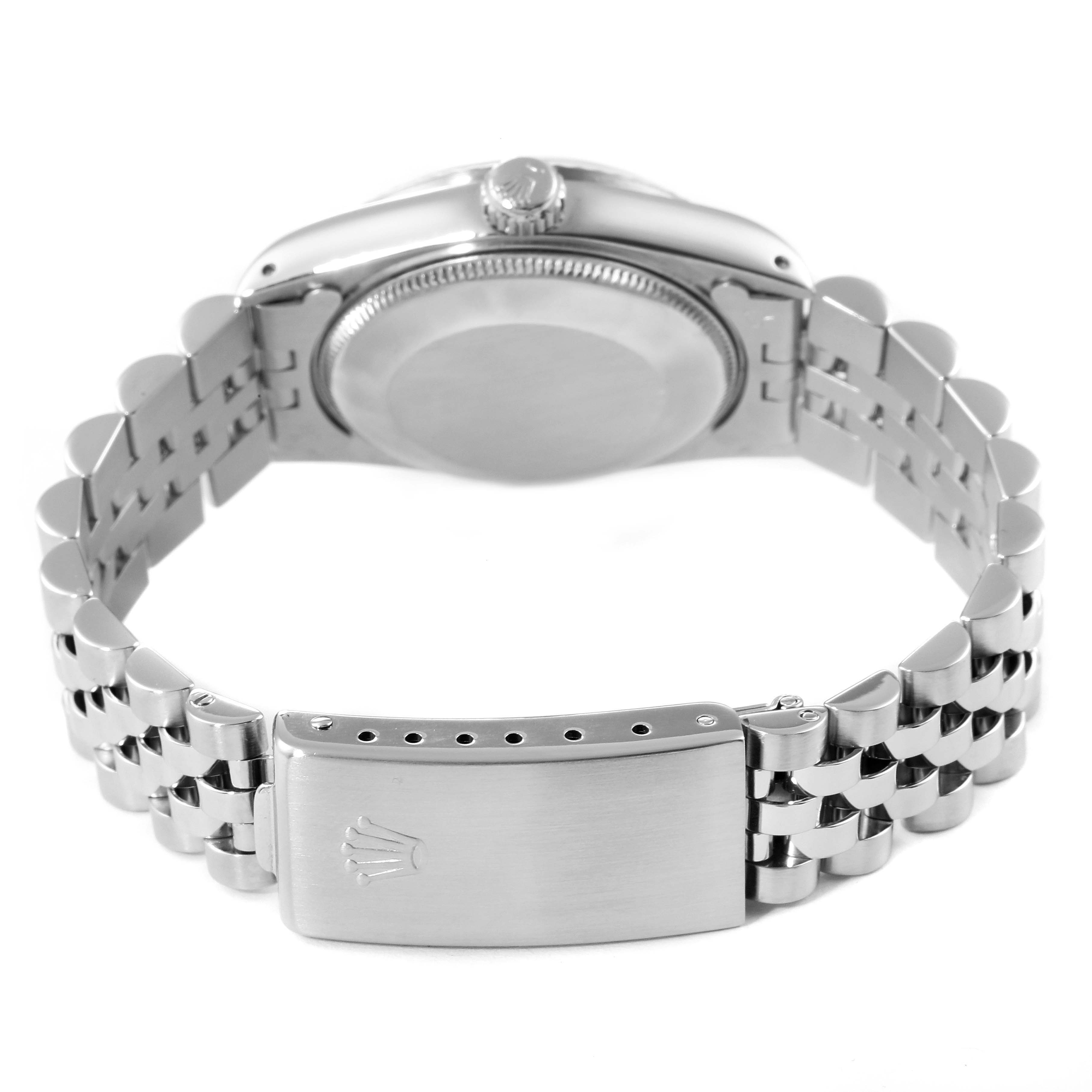 The image shows the back case and the bracelet clasp of a Mid-Size Rolex watch from a rear angle.