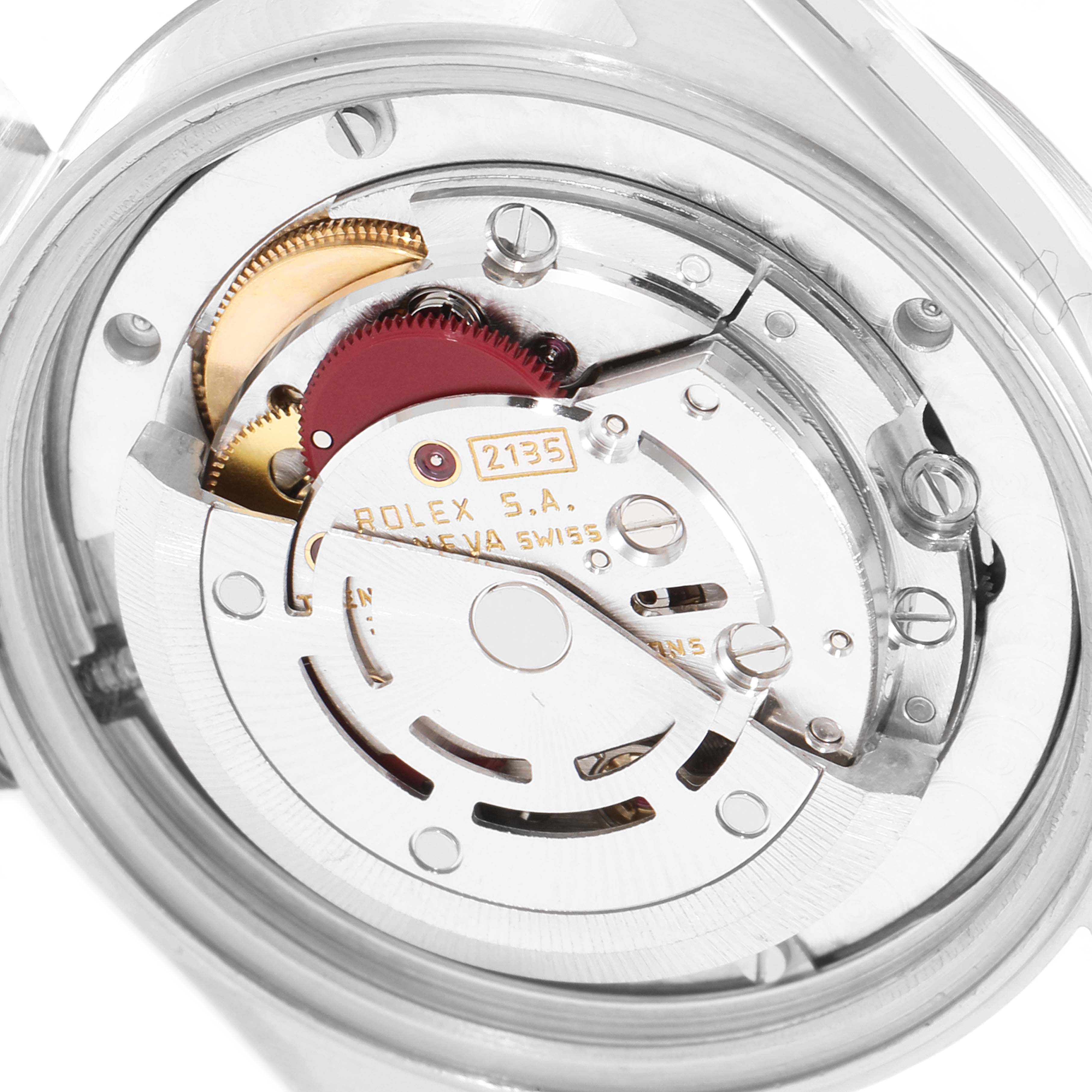 This image shows the internal mechanism of a Mid-Size Rolex watch viewed from the back.