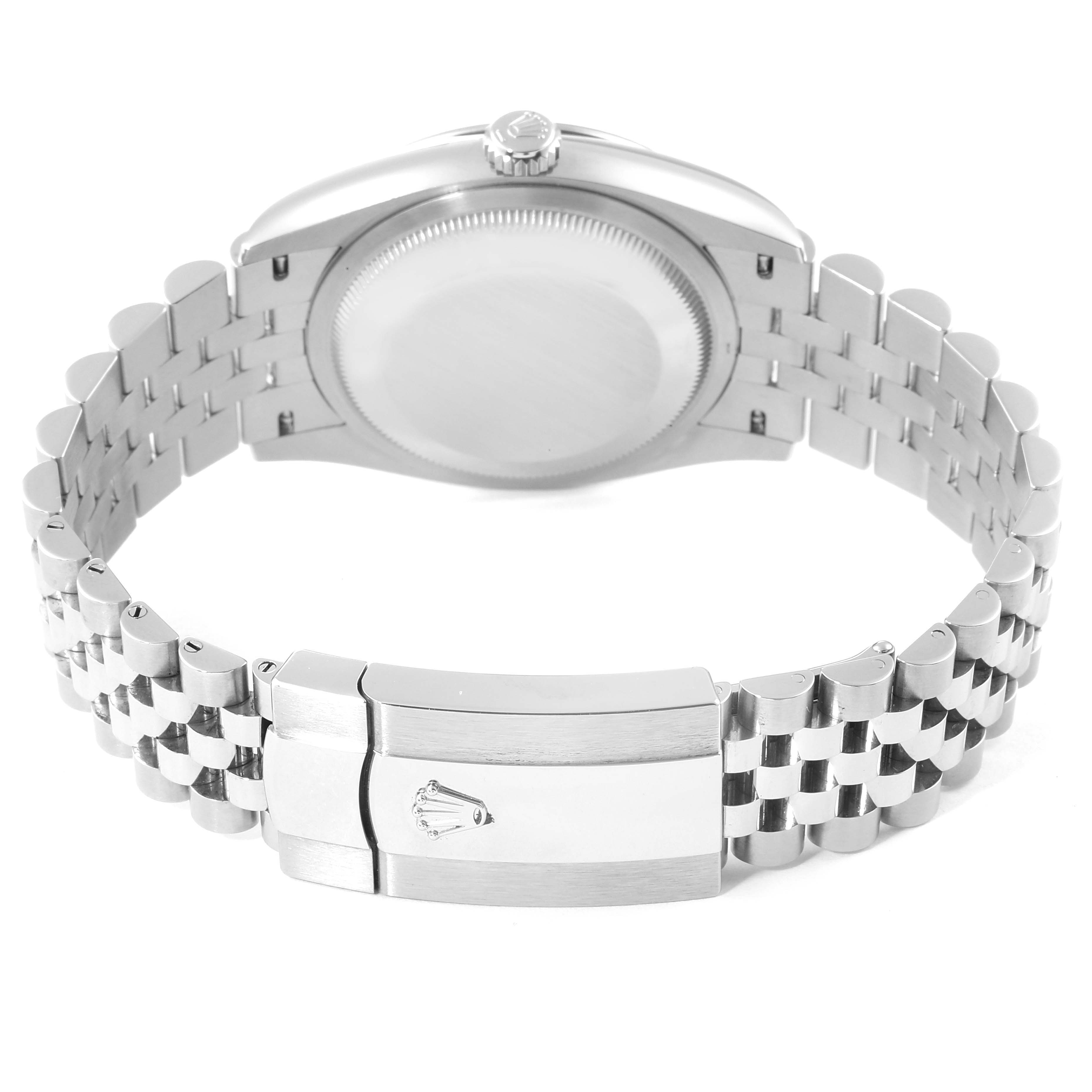The image shows the back view of a Datejust model by Rolex, highlighting the watch case and Jubilee bracelet clasp.