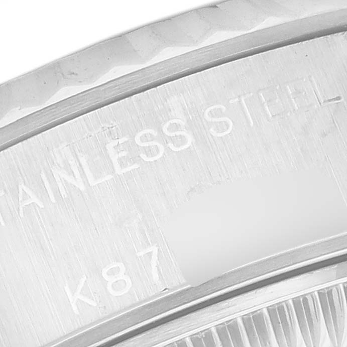 The image shows a close-up angle of the stainless steel bezel with engravings on a Rolex Datejust 79174 Women's Stainless Steel Mother of Pearl Dial 79174 Women's Stainless Steel Mother of Pearl Dial watch.