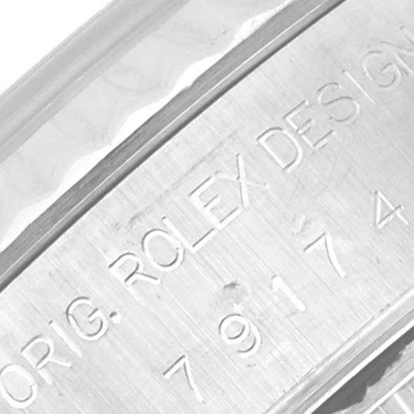 This close-up angle shows the engraved side of the case of a Rolex Datejust 79174 Women's Stainless Steel Mother of Pearl Dial 79174 Women's Stainless Steel Mother of Pearl Dial watch.