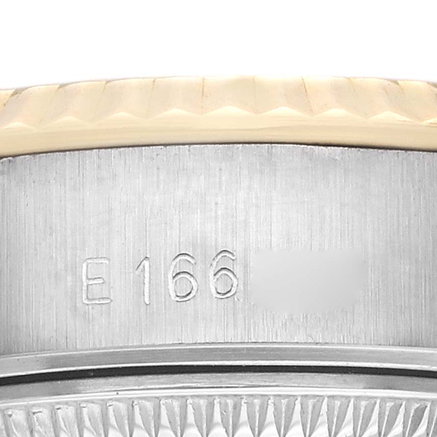 The image shows a close-up of the side of a Rolex Datejust model 69173 watch with the serial number engraved on the case.