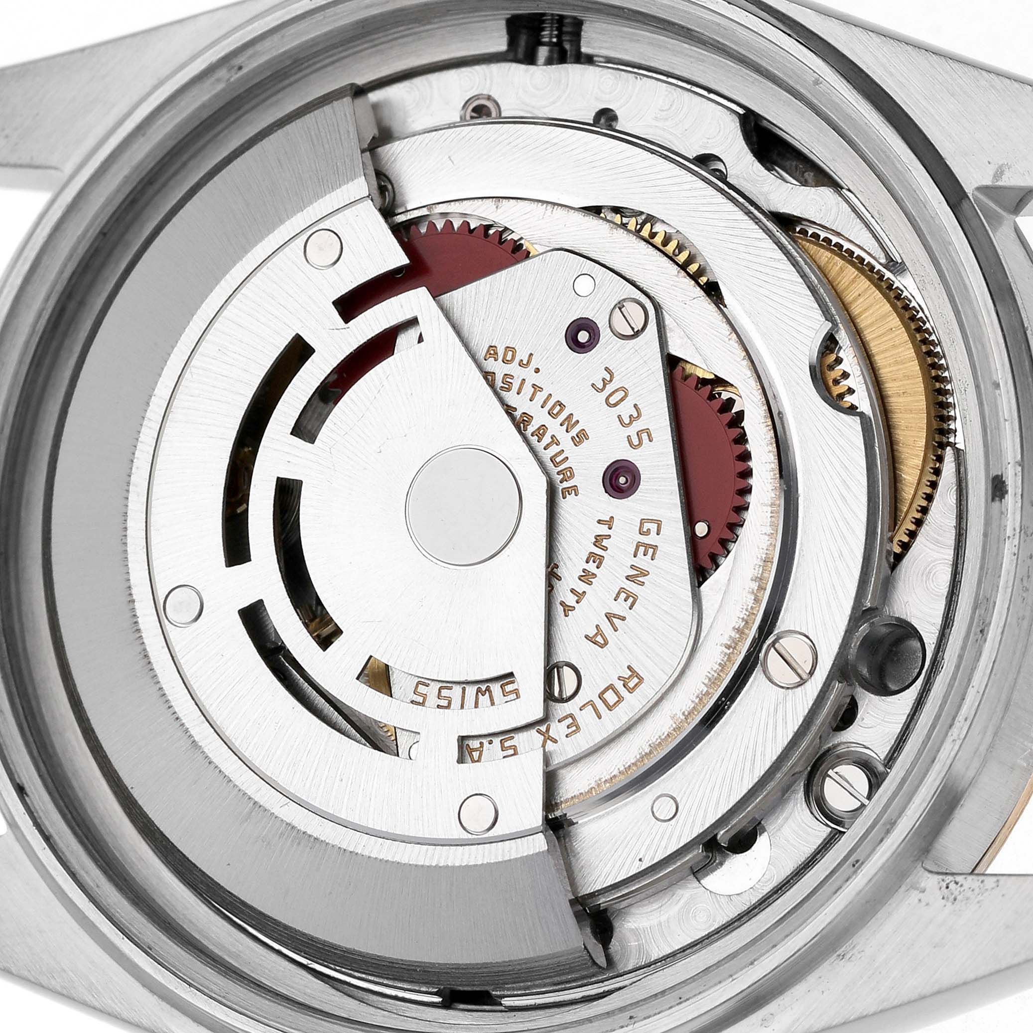 The image shows the movement of a Rolex Vintage Collection 16013 Men's Steel and Gold (two tone) White Dial watch from the back, highlighting the rotor and internal gears.