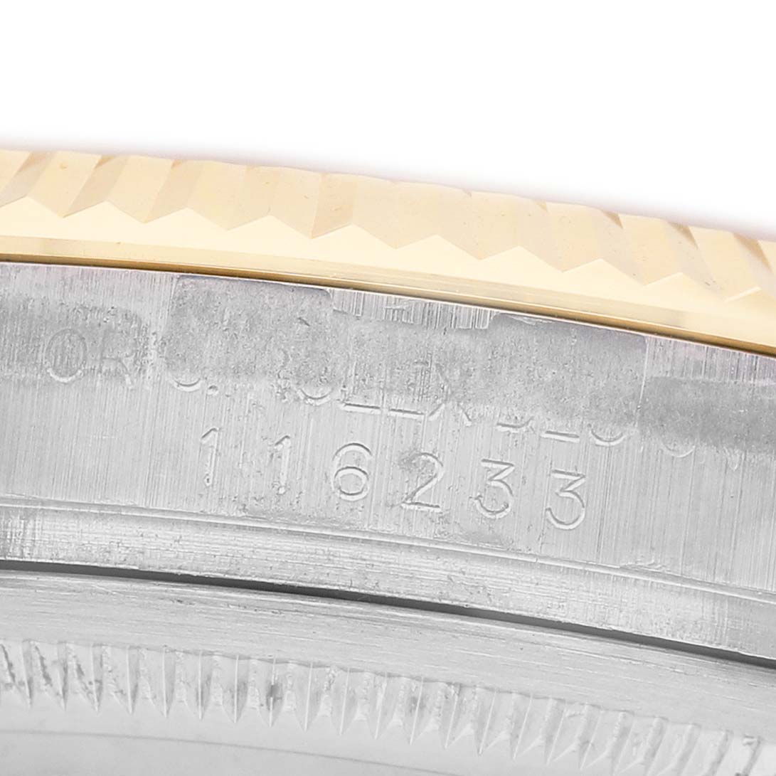 The image shows a close-up of the case edge and bezel of a Rolex Datejust 116233 Men's Stainless Steel Champagne Dial, highlighting the model number engraving.