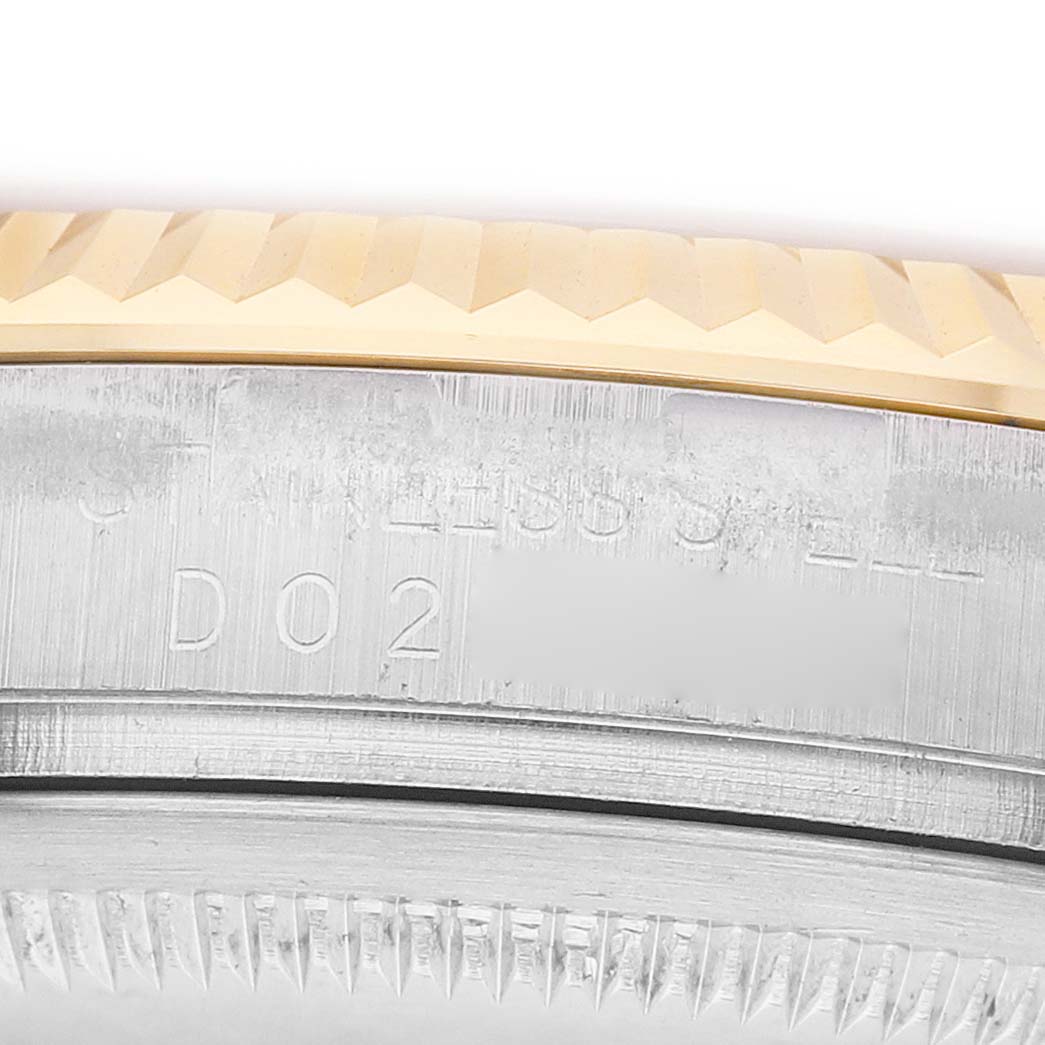 The image shows a close-up of the case and bezel of a Rolex Datejust 116233 Men's Stainless Steel Champagne Dial, highlighting the fluted bezel details.