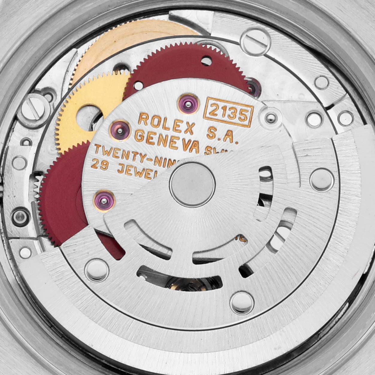 This is a close-up view of the Rolex Datejust 69173 Women's Steel and Gold (two tone) Champagne Dial 69173 Women's Steel and Gold (two tone) Champagne Dial's internal movement mechanism, showcasing gears and the rotor.