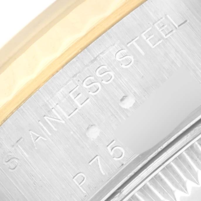 This close-up image shows the stainless steel part with engraved text of a Rolex Datejust 79173 Women's Steel and Gold (two tone) Grey Dial 79173 Women's Steel and Gold (two tone) Grey Dial watch.