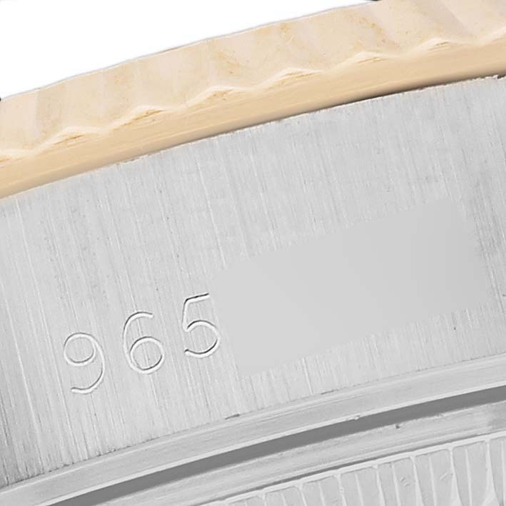 This close-up image shows the bezel and part of the case back of a Rolex Datejust 69173 Women's Steel and Gold (two tone) Champagne Dial 69173 Women's Steel and Gold (two tone) Champagne Dial watch.