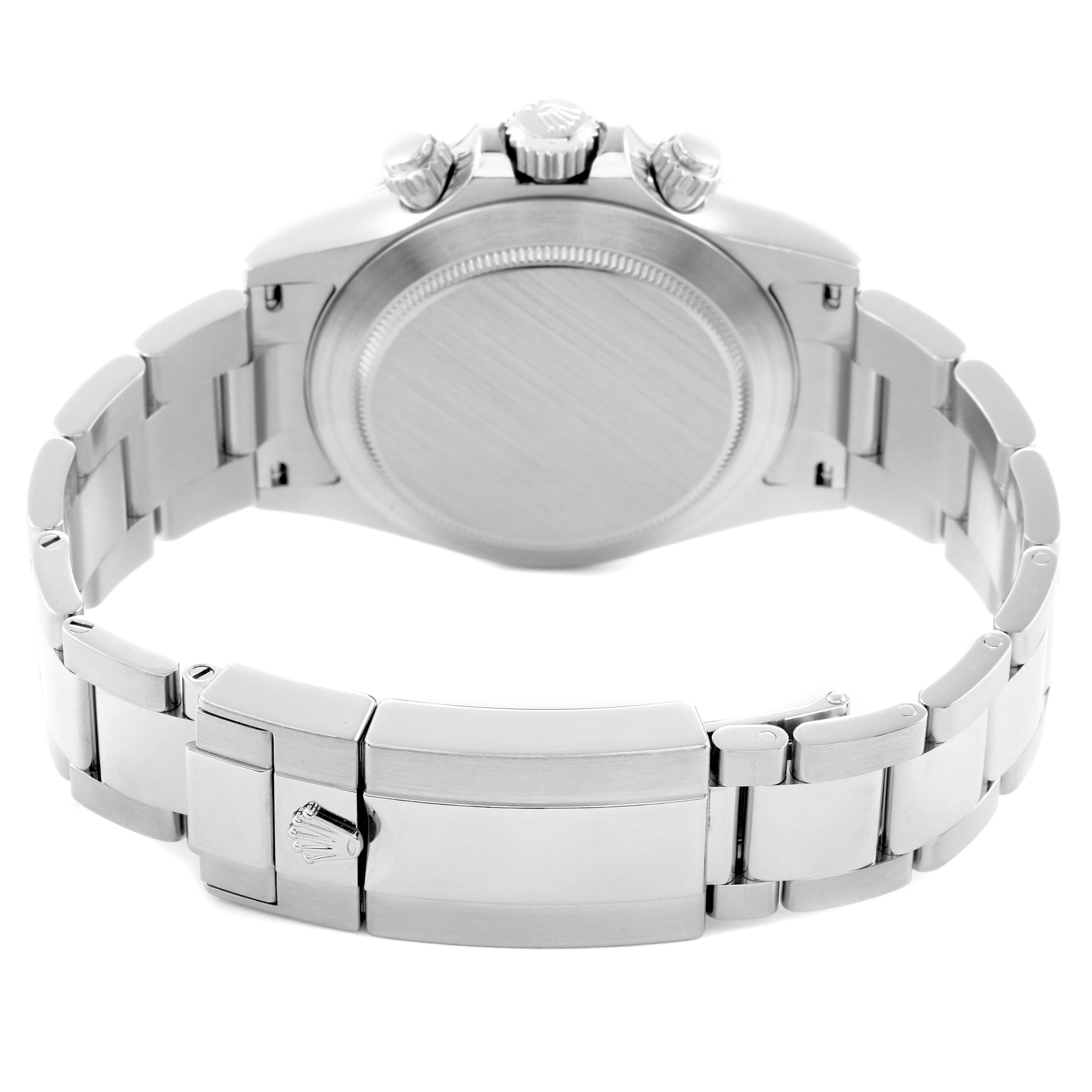 The image shows the back of a Rolex Daytona model 116520 men's watch, highlighting the case back and stainless steel bracelet with a visible clasp.