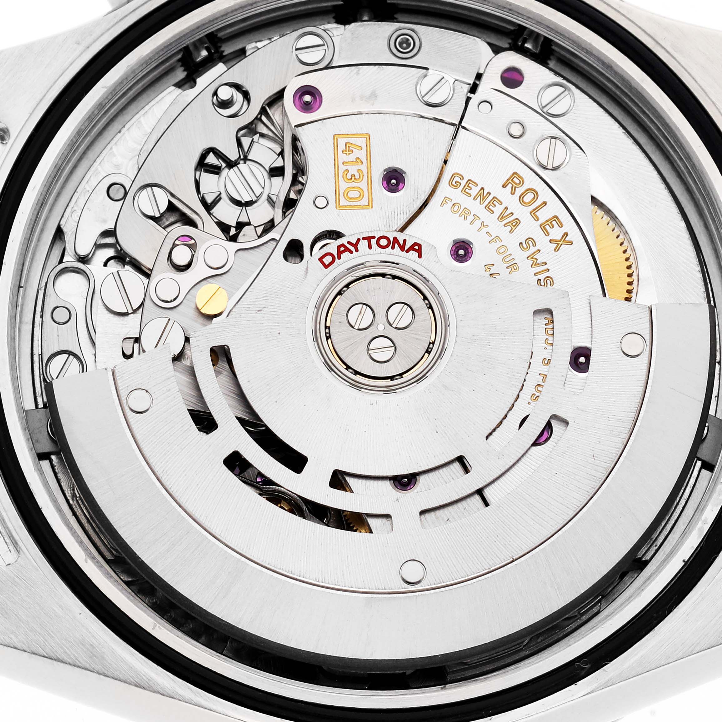 The image shows the movement of a Rolex Daytona model 116520 men's watch, highlighting its intricate inner mechanics and rotor from a close-up angle.