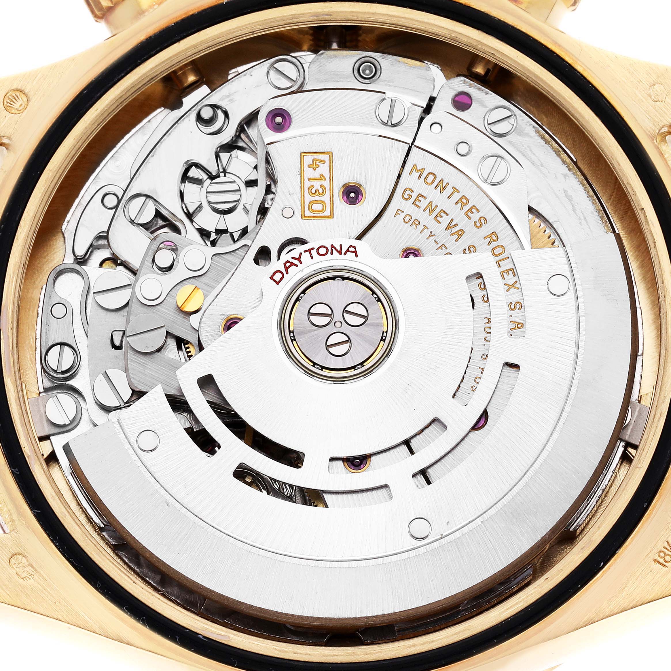 The image shows the movement of a Rolex Daytona model 116528, highlighting the intricate mechanics and rotor from a back angle viewpoint.