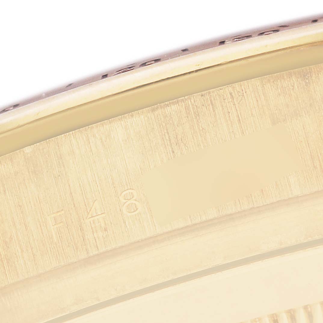 The image shows a close-up angle of the Rolex Daytona model number 116528, focusing on the edge of the case with visible engravings.