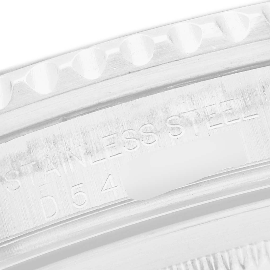 This close-up image shows the side view of a Rolex GMT-Master model 16710, focusing on the engraved stainless steel bezel and part of the case.
