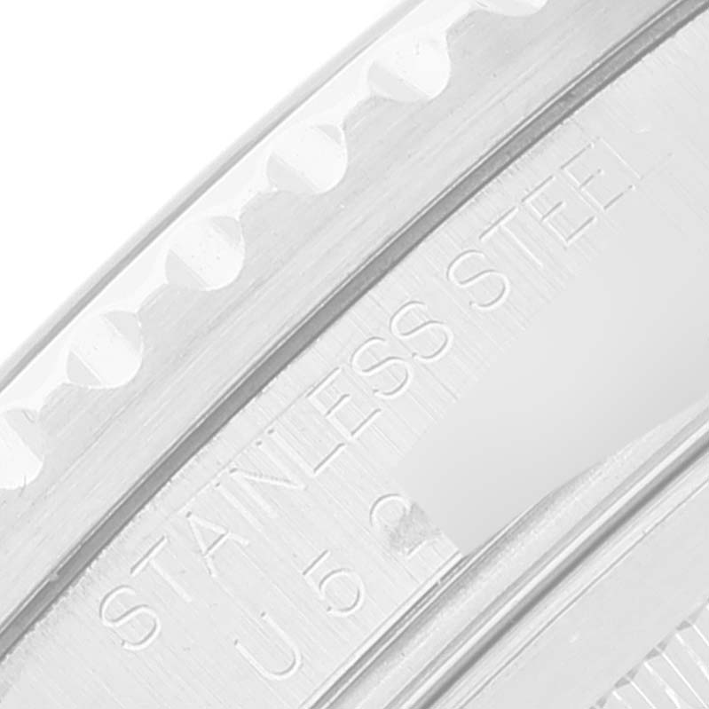 The image shows a close-up of the stainless steel bezel with engravings on a Rolex GMT-Master 16710 Men's Stainless Steel Black Dial 16710 Men's Stainless Steel Black Dial watch.