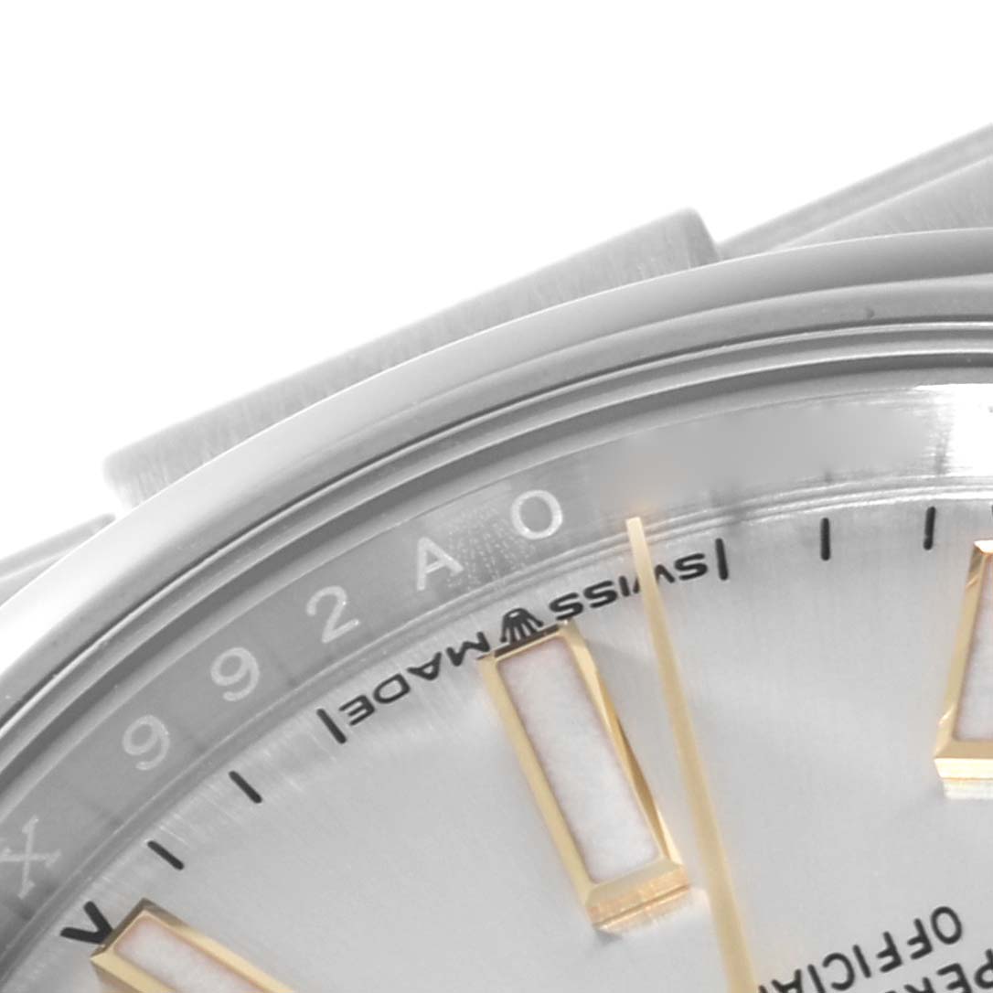 This is a close-up view of the bezel and part of the dial of a Rolex Oyster Perpetual 124200 Men's Stainless Steel Silver Dial 124200 Men's Stainless Steel Silver Dial watch.