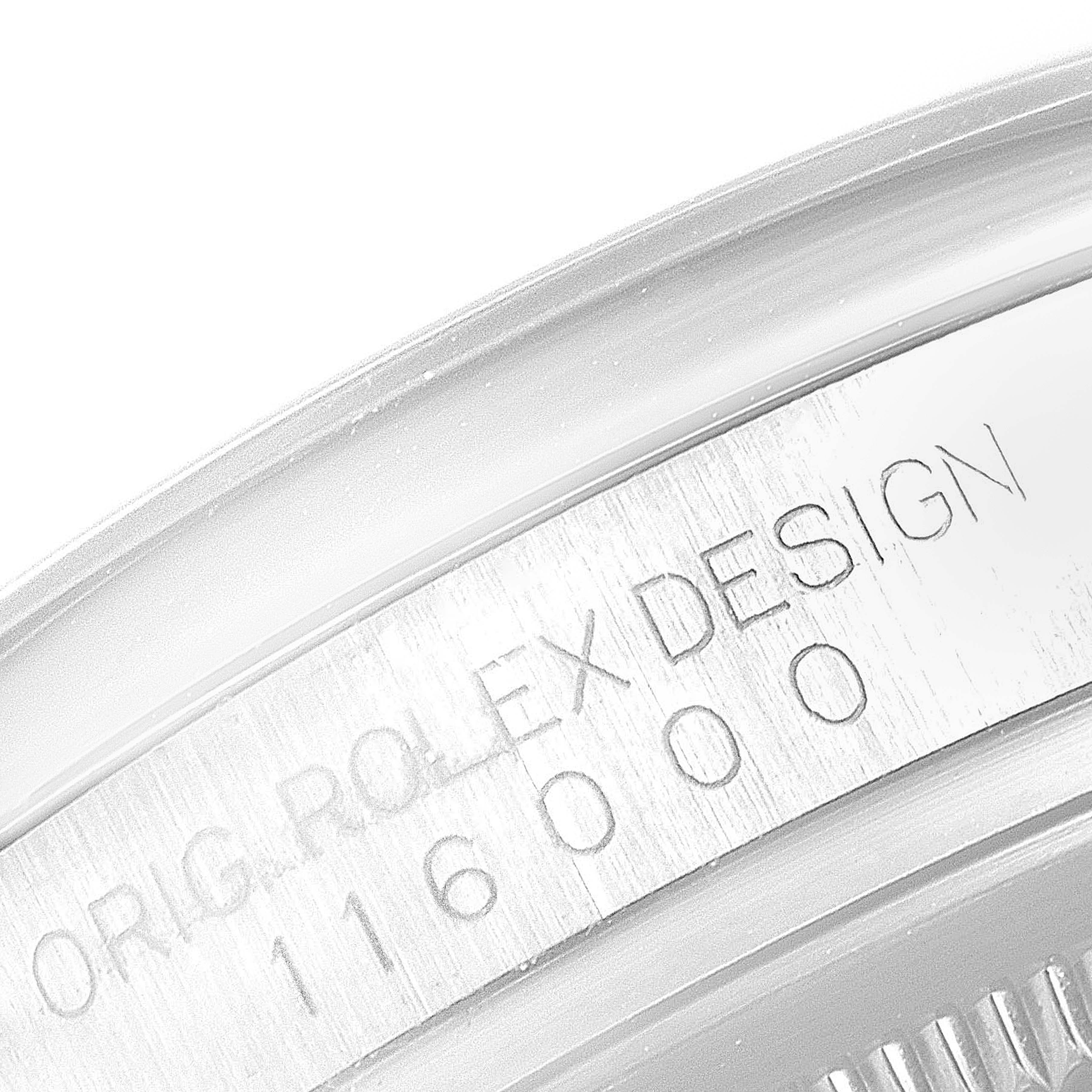 This image shows a close-up of the case rim for a Rolex Oyster Perpetual 116000 Men's Stainless Steel Champagne Dial 116000 Men's Stainless Steel Champagne Dial watch, featuring the engraved model number.