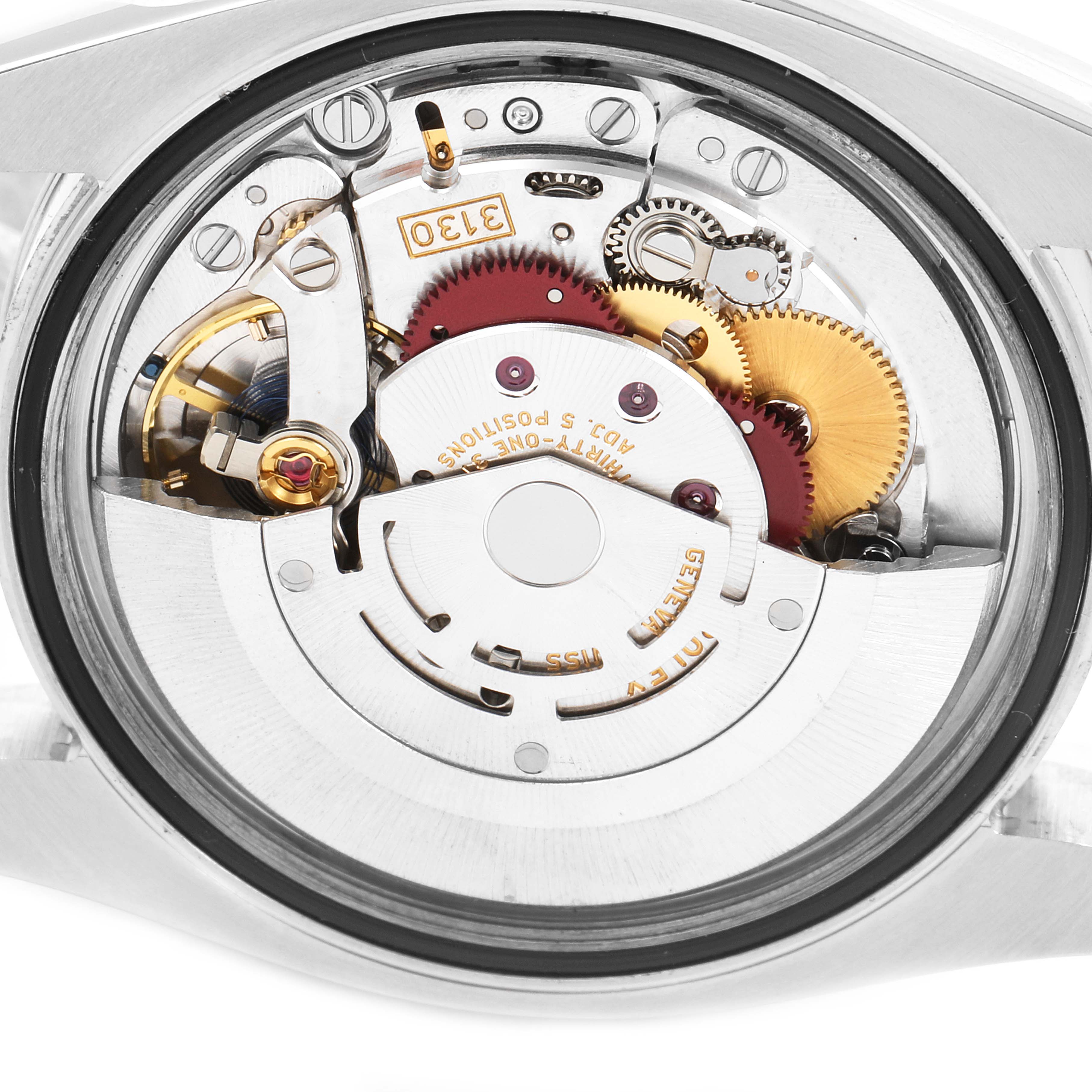 The image shows the internal mechanical movement of a Rolex Oyster Perpetual 116000 Men's Stainless Steel Champagne Dial 116000 Men's Stainless Steel Champagne Dial watch from the back.