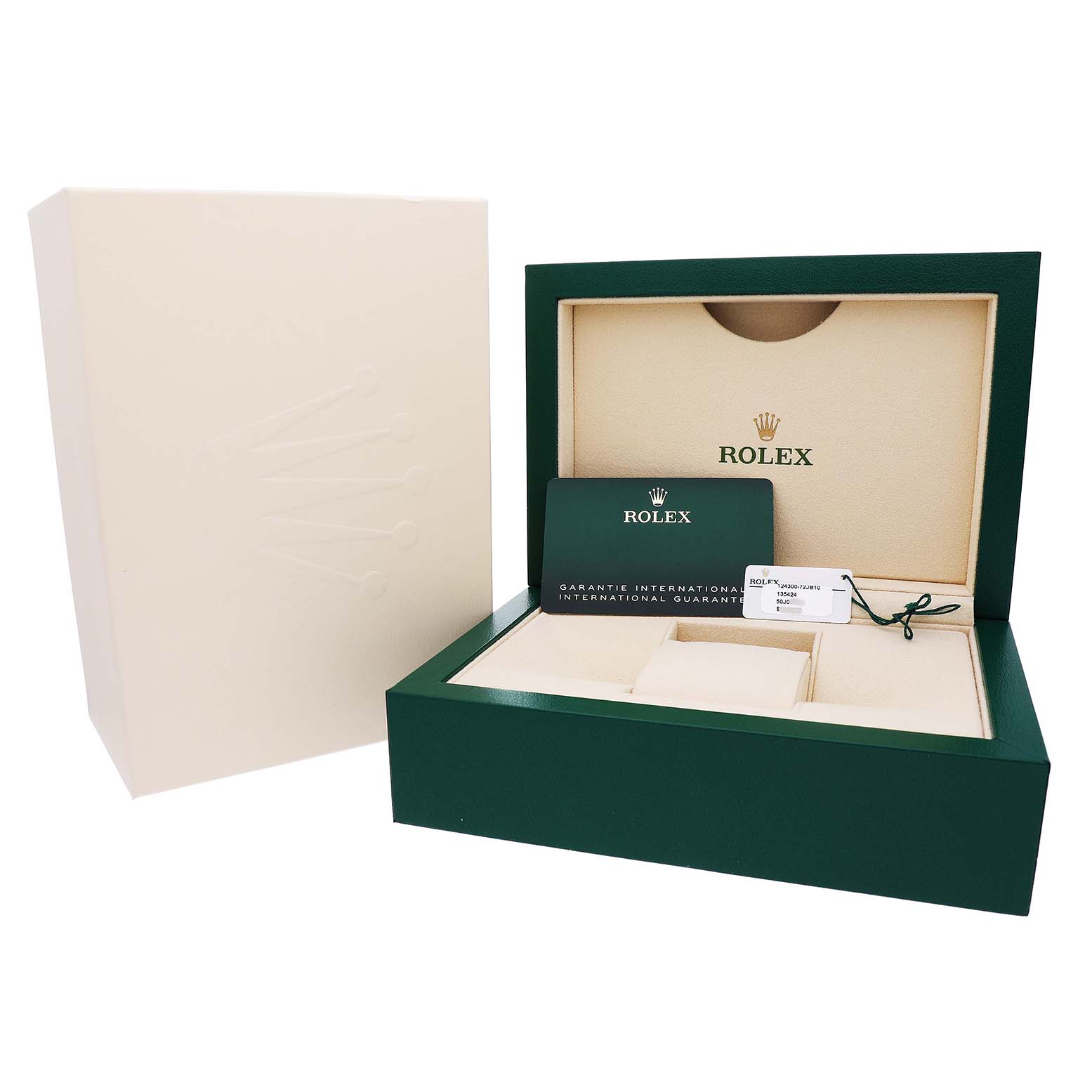 The image shows an open Rolex Oyster Perpetual 124300 Men's Stainless Steel Blue Dial watch box with a warranty card and tag, displaying the interior packaging.