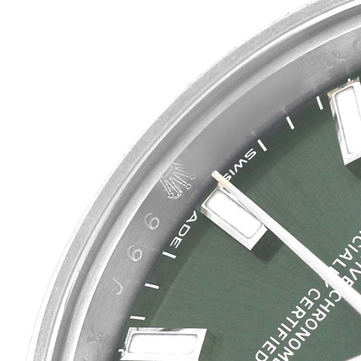 The image shows a close-up of the Rolex Oyster Perpetual 176200 Women's Stainless Steel Green Dial watch face, focusing on the dial and hour markers from an angled view.