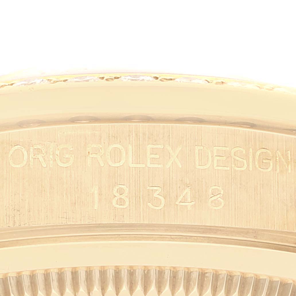 The image shows a close-up of the side of a Rolex President 18348 Men's Yellow Gold Champagne Dial 18348 Men's Yellow Gold Champagne Dial model watch, focusing on the engraved model number.