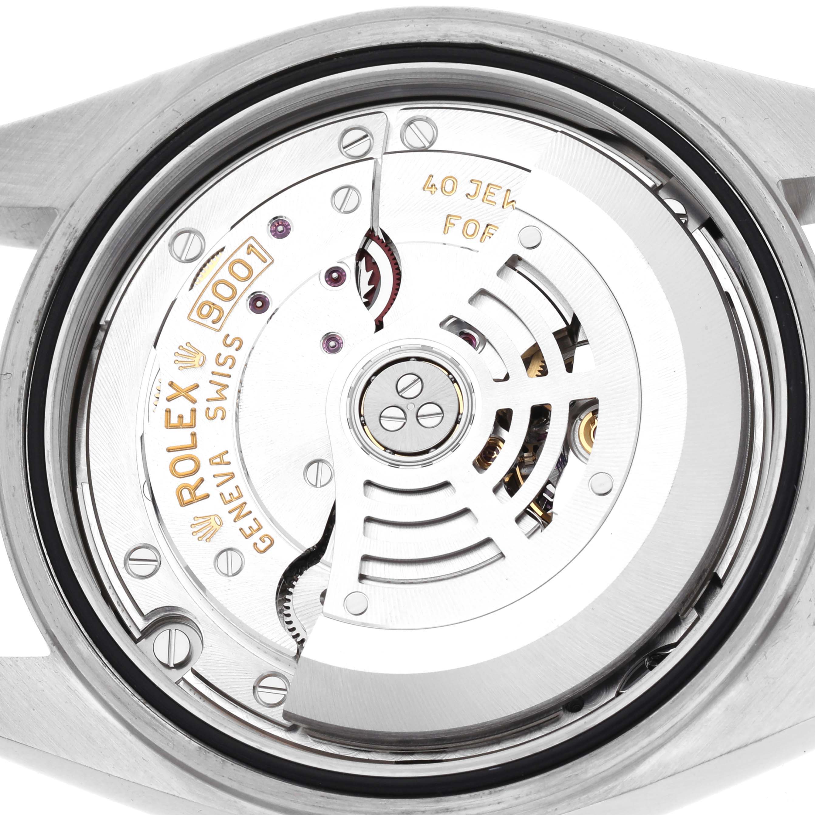 The image shows the movement of a Rolex Sky-Dweller model number 326934, viewed from the back, highlighting the intricate mechanical parts and rotor.