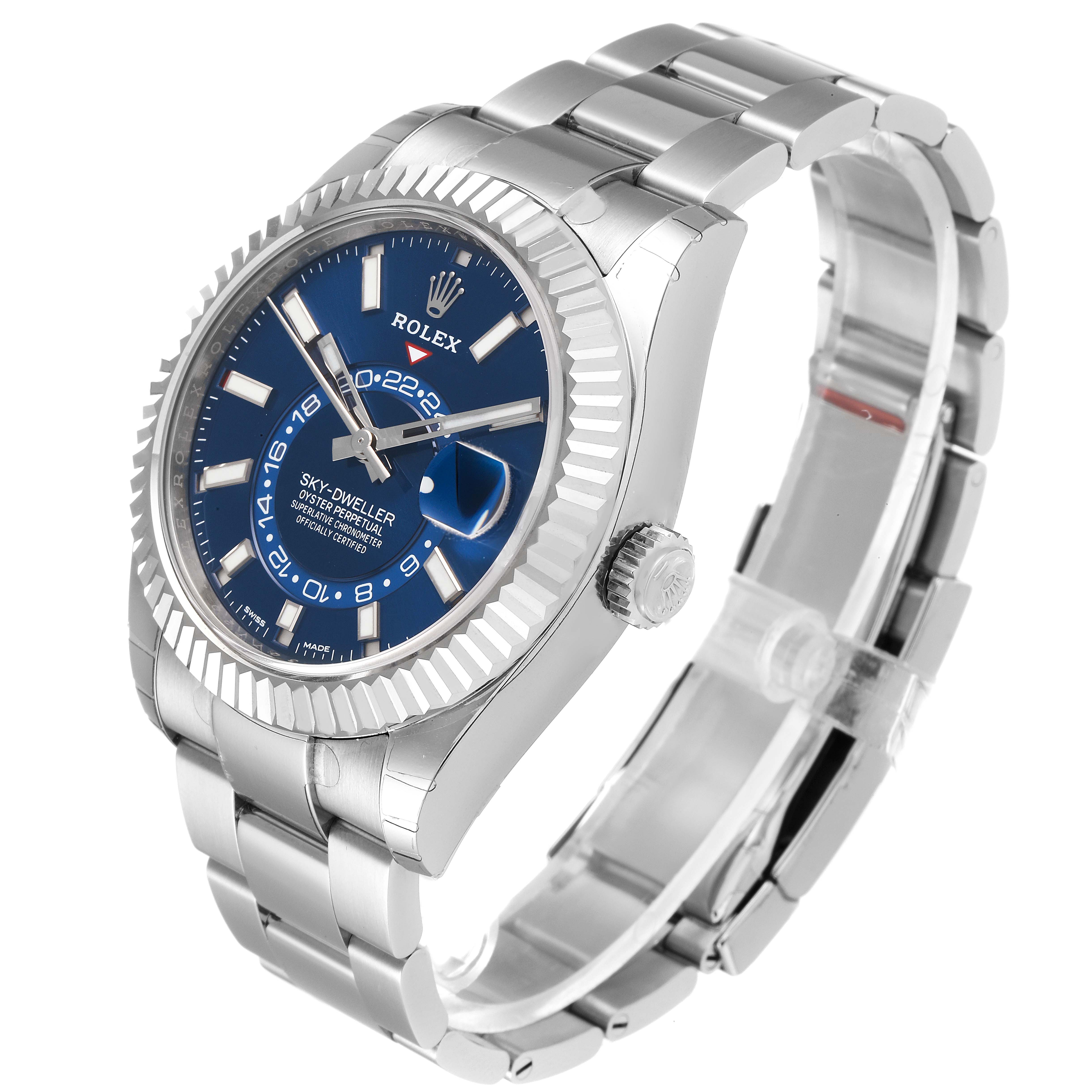 The image shows a Rolex Sky-Dweller 326934 Men's Stainless Steel Blue Dial 326934 Men's Stainless Steel Blue Dial watch from a front-side angle, highlighting the blue dial, fluted bezel, and stainless steel bracelet.