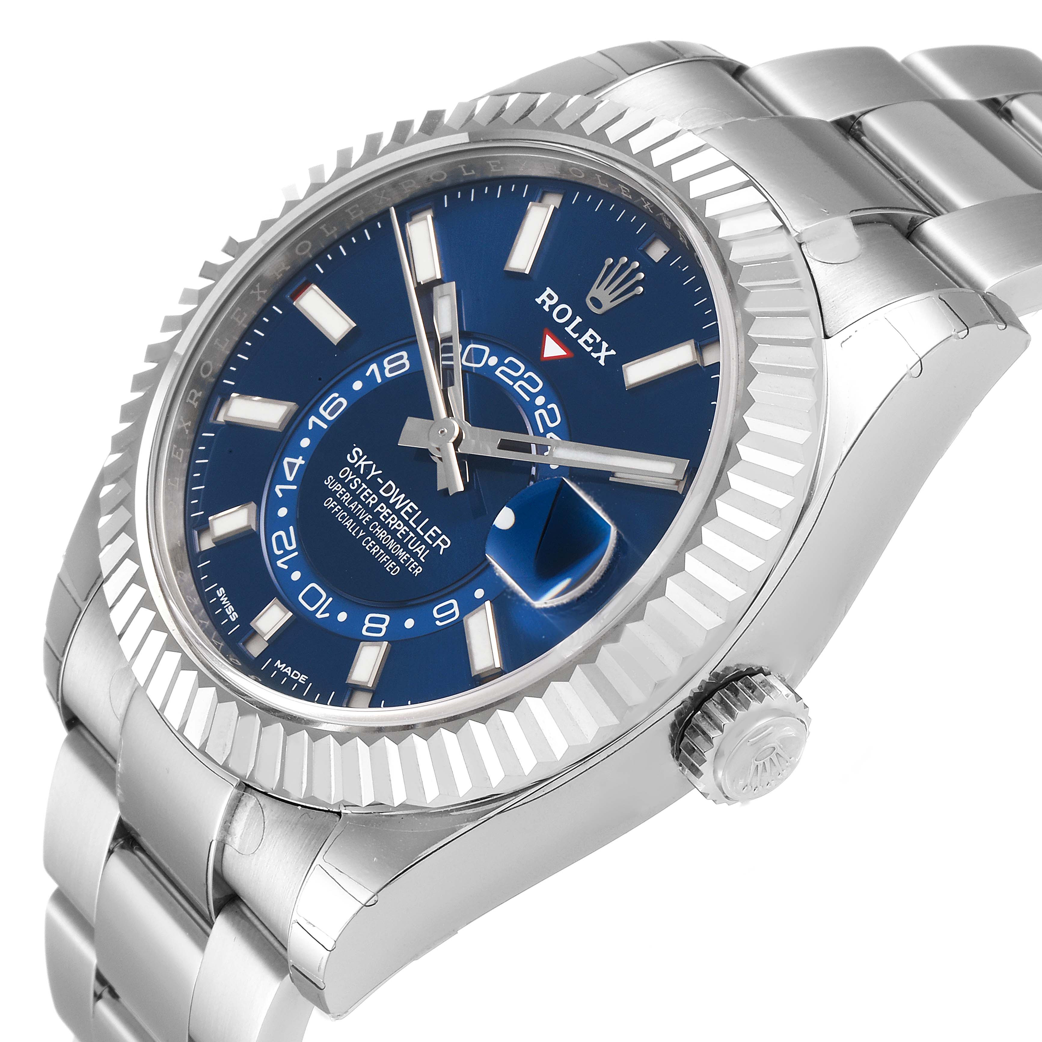 The image shows a Rolex Sky-Dweller 326934 Men's Stainless Steel Blue Dial 326934 Men's Stainless Steel Blue Dial watch at an oblique angle, highlighting its blue dial, fluted bezel, and metal bracelet.