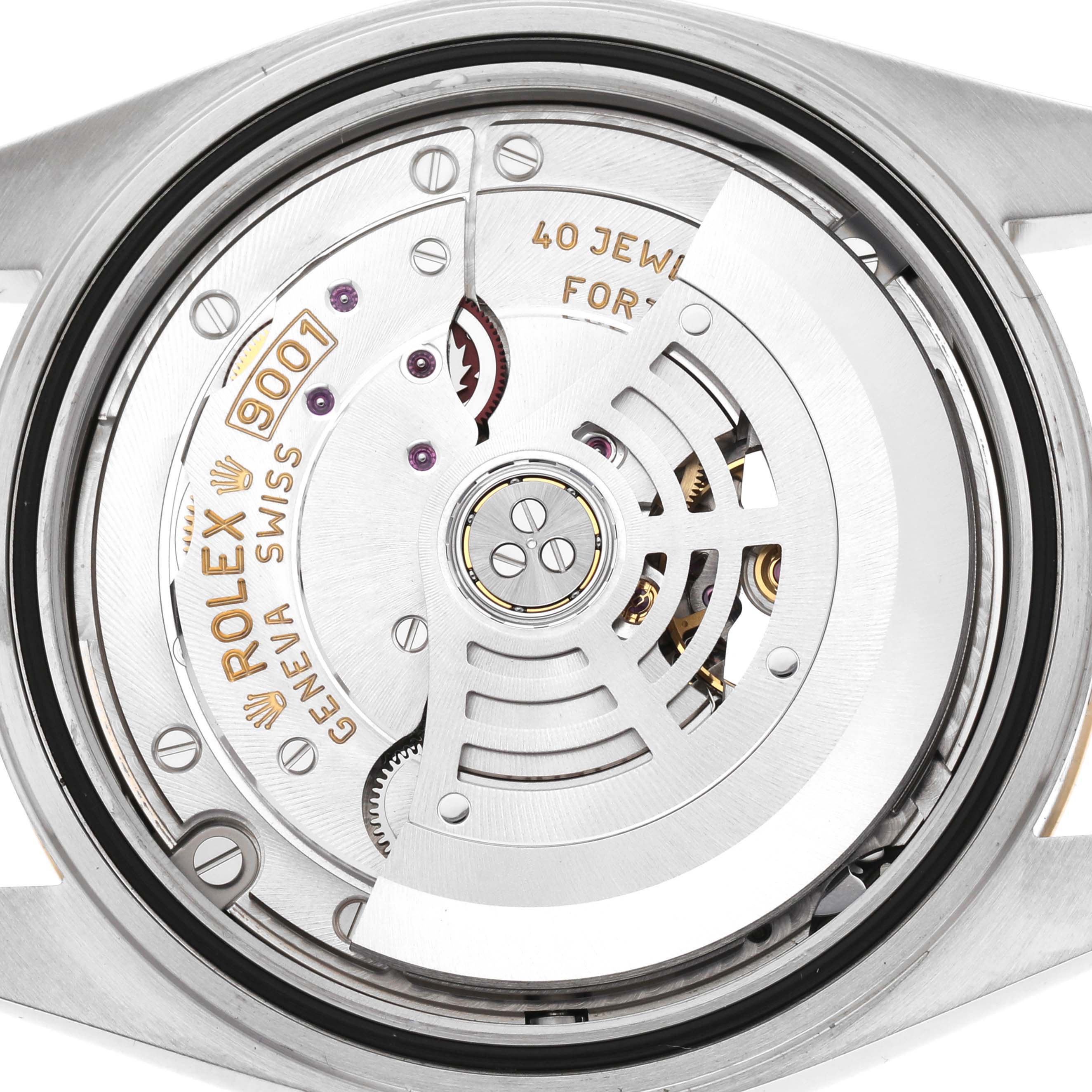 The image shows the movement of a Rolex Sky-Dweller model 326933, highlighting its internal mechanisms and "40 JEWELS" engraving from a top-down angle.