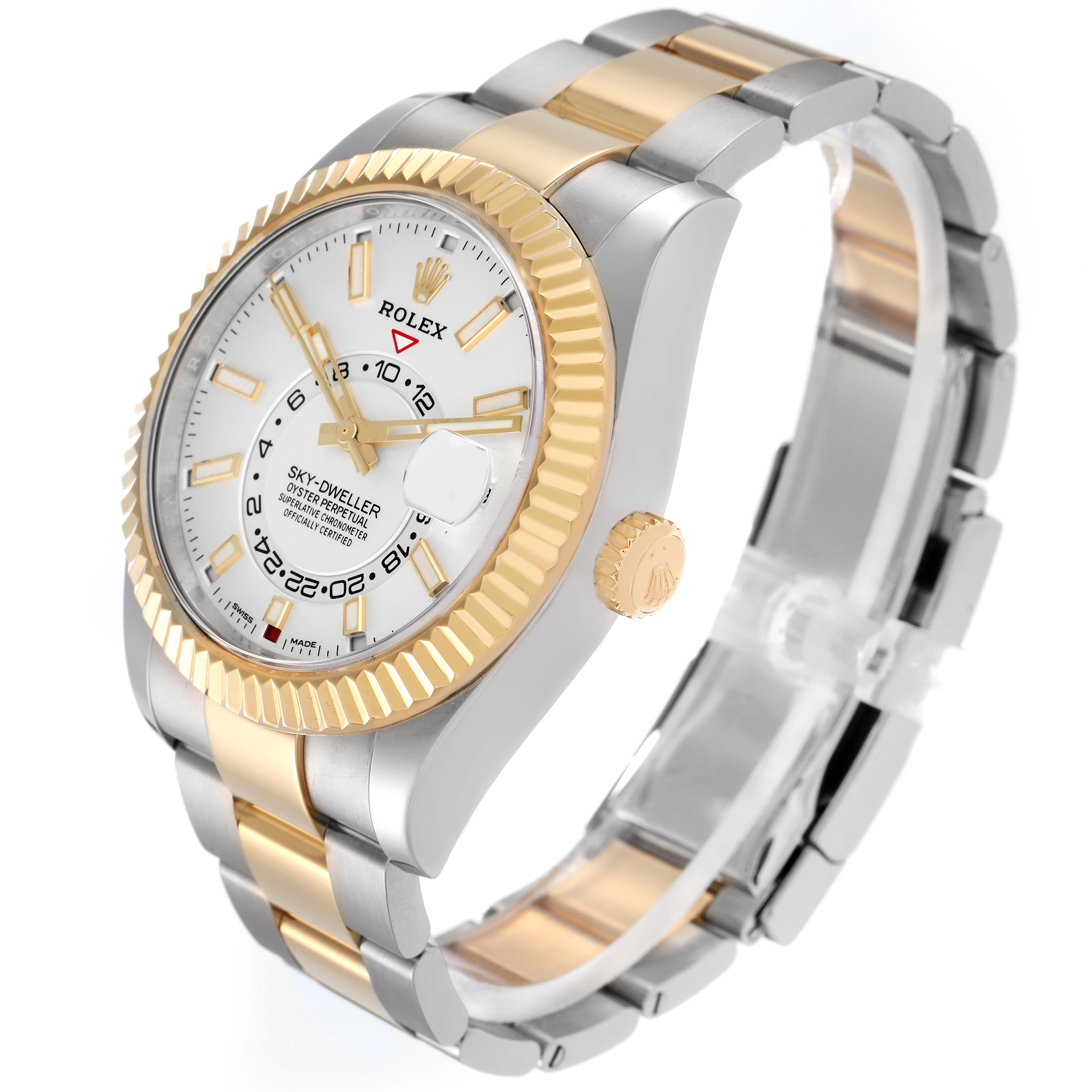 The Rolex Sky-Dweller model 326933 is shown at an angle highlighting its gold bezel, white dial, and two-tone bracelet, with the crown and part of the side visible.