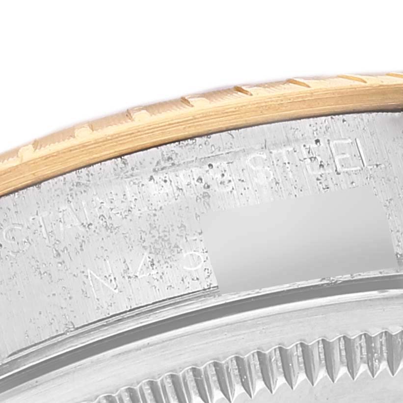 This image shows a close-up of the case edge and part of the bezel of a Rolex Date 15223 Men's Steel and Gold (two tone) Grey Dial 15223 Men's Steel and Gold (two tone) Grey Dial model watch.