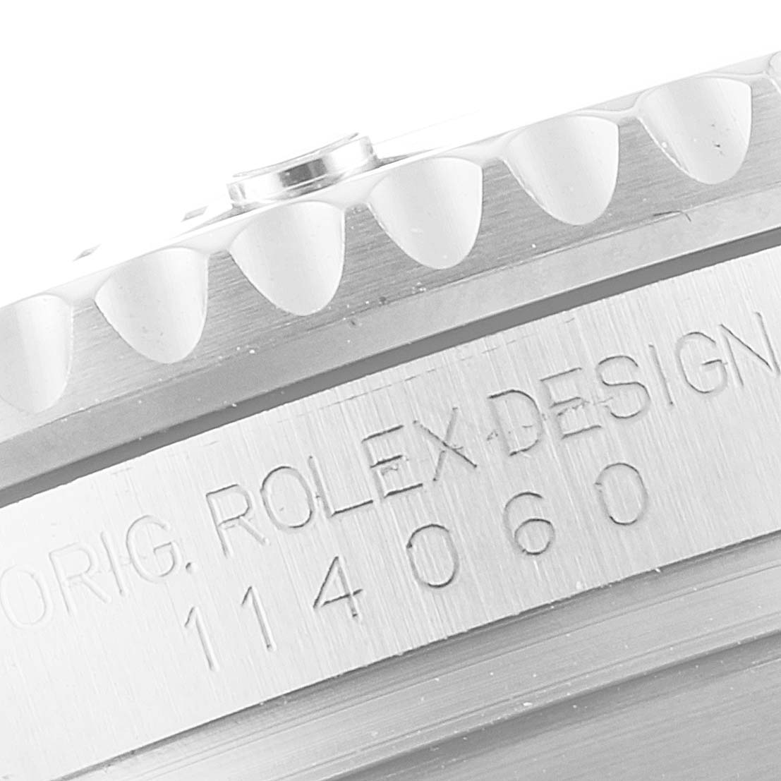This close-up angle of the Rolex Submariner 114060 Men's Stainless Steel Black Dial 114060 Men's Stainless Steel Black Dial watch shows the engraved model number and part of the bezel.