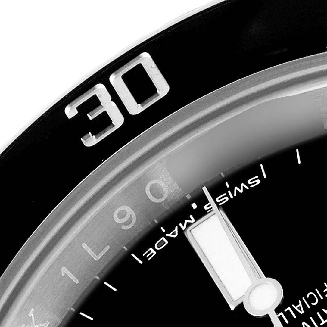 The image shows a close-up of the bezel and part of the dial of a Rolex Submariner 114060 Men's Stainless Steel Black Dial 114060 Men's Stainless Steel Black Dial watch, focusing on the 30-minute marker.
