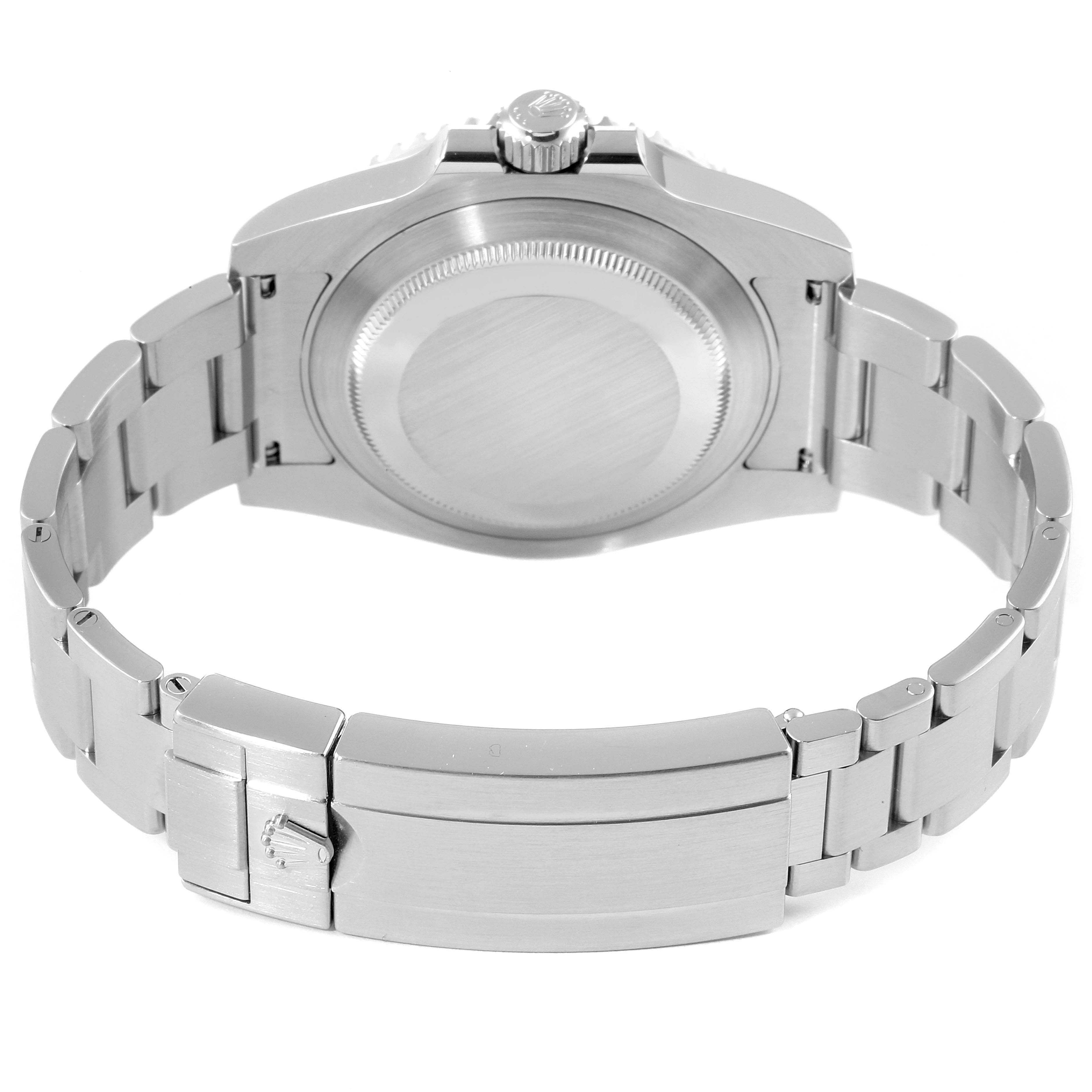 The image shows the back view of a Rolex Submariner 114060 Men's Stainless Steel Black Dial 114060 Men's Stainless Steel Black Dial watch focusing on its clasp, case back, and bracelet.