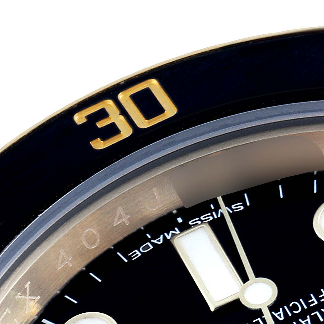 This image shows a close-up of the bezel and part of the dial of a Rolex Submariner 116618 Men's Yellow Gold Black Dial 116618 Men's Yellow Gold Black Dial watch, focusing on the "30" minute marker.