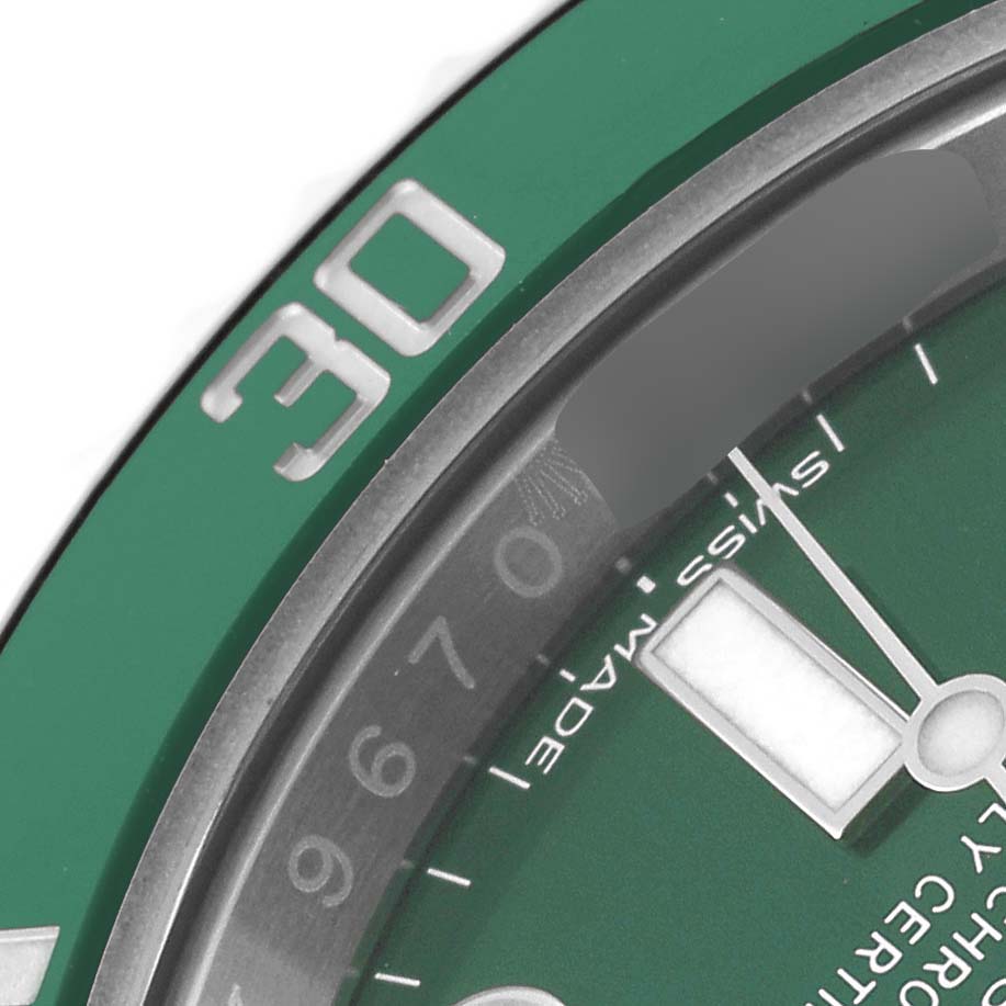 This close-up image shows the green bezel, minute hand, and part of the dial of a Rolex Submariner 116610LV Men's Stainless Steel Green Dial 116610LV Men's Stainless Steel Green Dial watch.