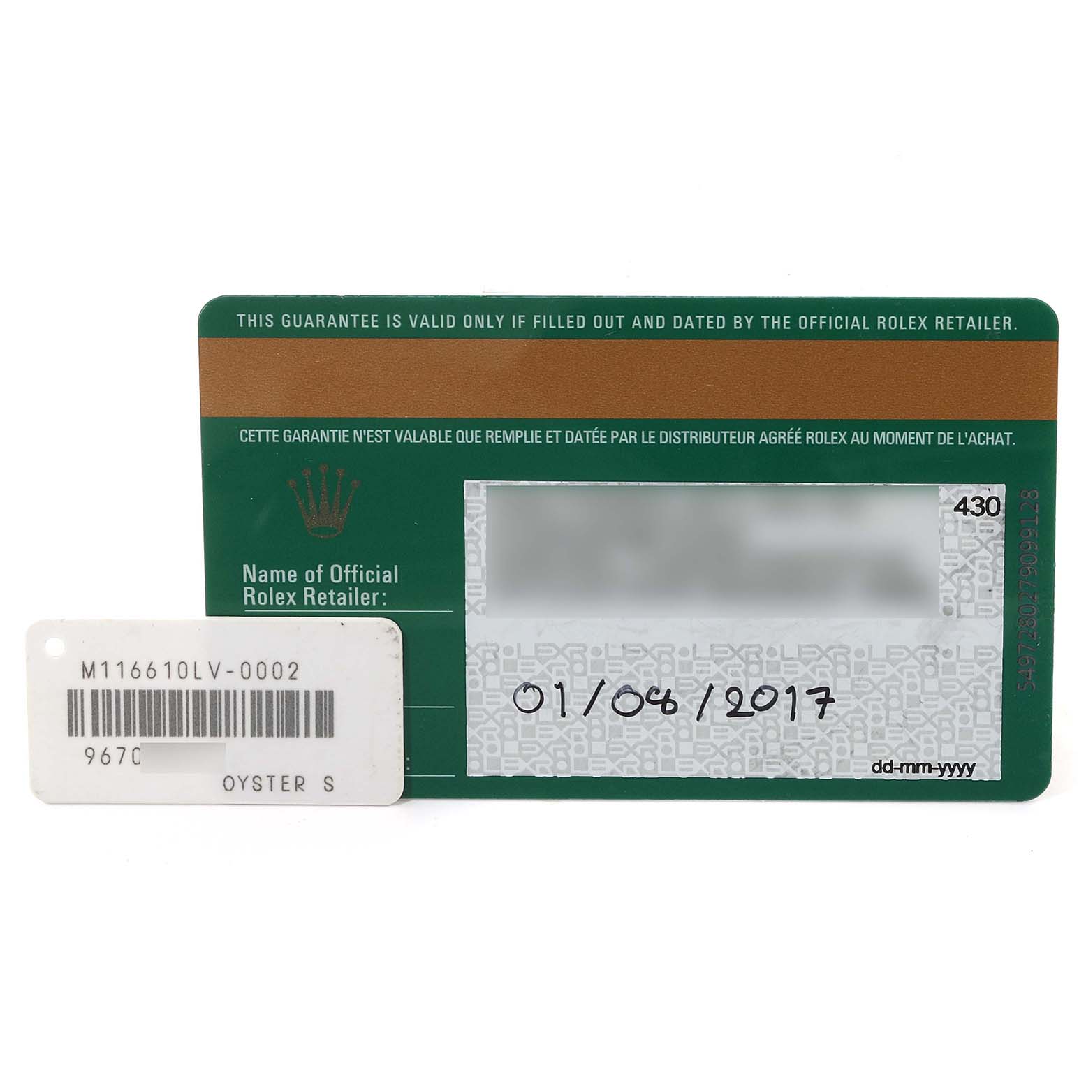 The image shows a warranty card and a tag with the model number for a Rolex Submariner 116610LV Men's Stainless Steel Green Dial 116610LV Men's Stainless Steel Green Dial watch.
