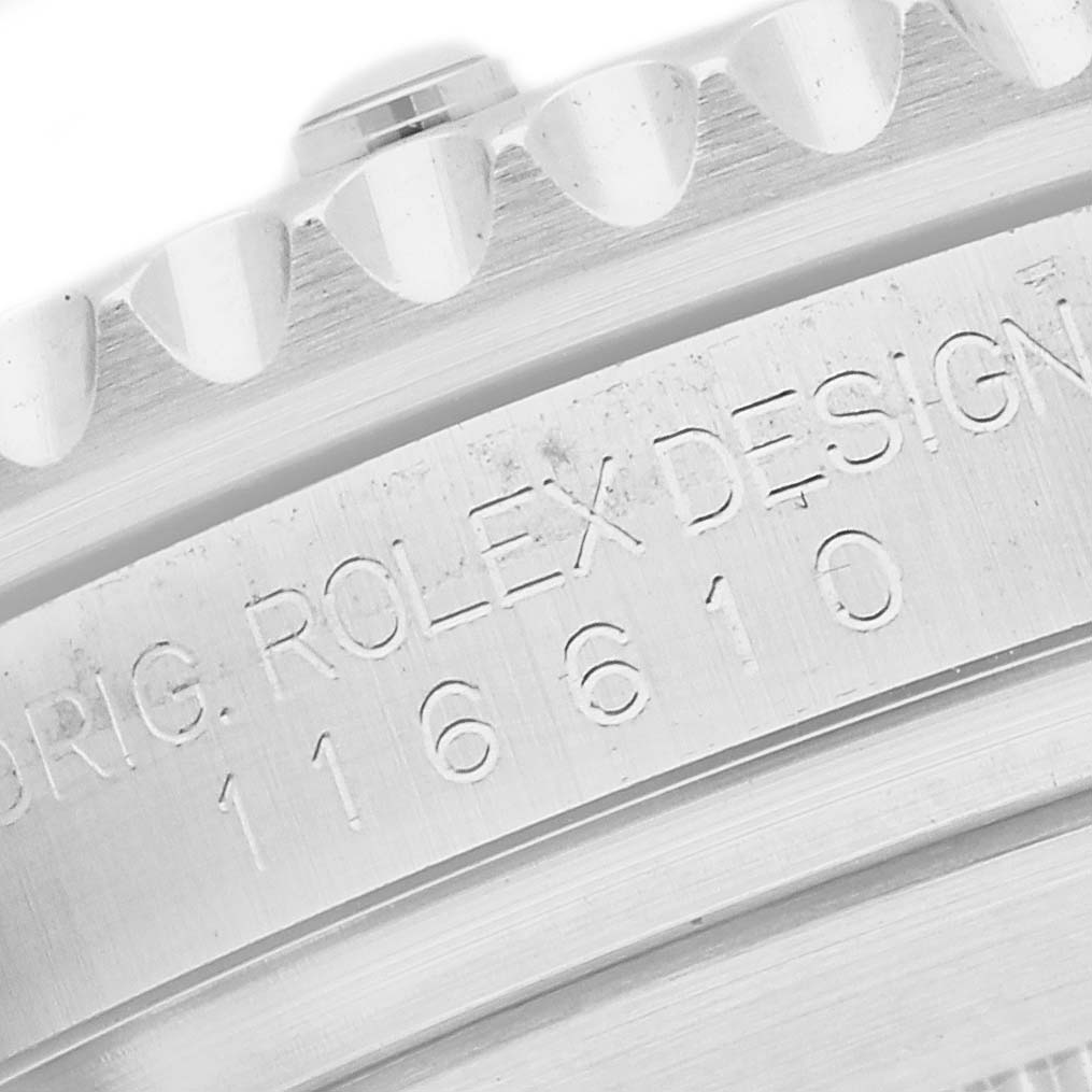 The image shows a close-up of the serial number and bezel teeth of a Rolex Submariner 116610LV Men's Stainless Steel Green Dial 116610LV Men's Stainless Steel Green Dial watch.